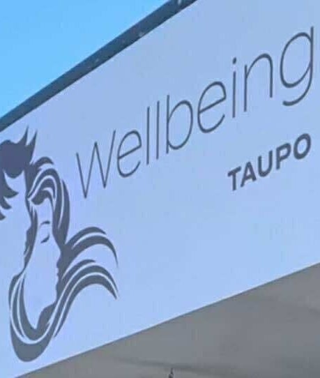 Exterior sign of Sleek Brows & CornBraids in Taupō, Waikato, NZ displaying 'Hair Beauty Wellbeing'.