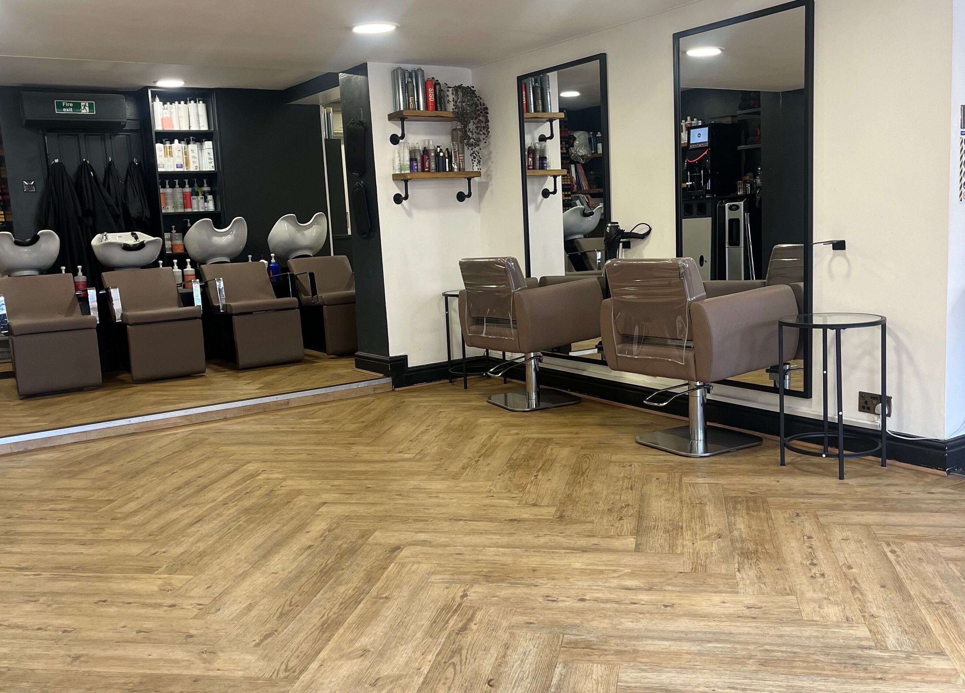 Elegant salon interior at House of Finesse, Altrincham, England, GB, featuring chic hair styling stations.
