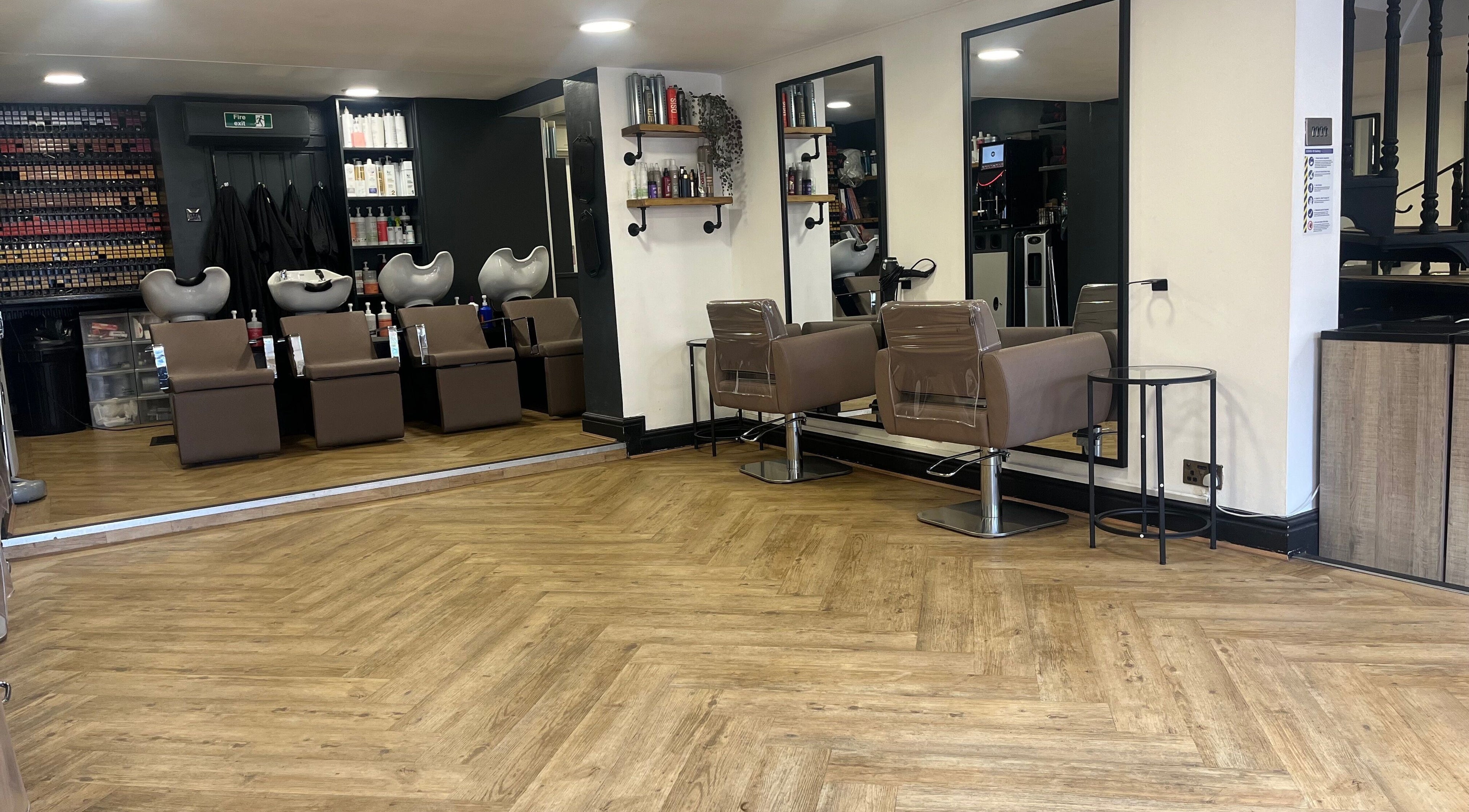 Elegant salon interior at House of Finesse, Altrincham, England, GB, featuring chic hair styling stations.
