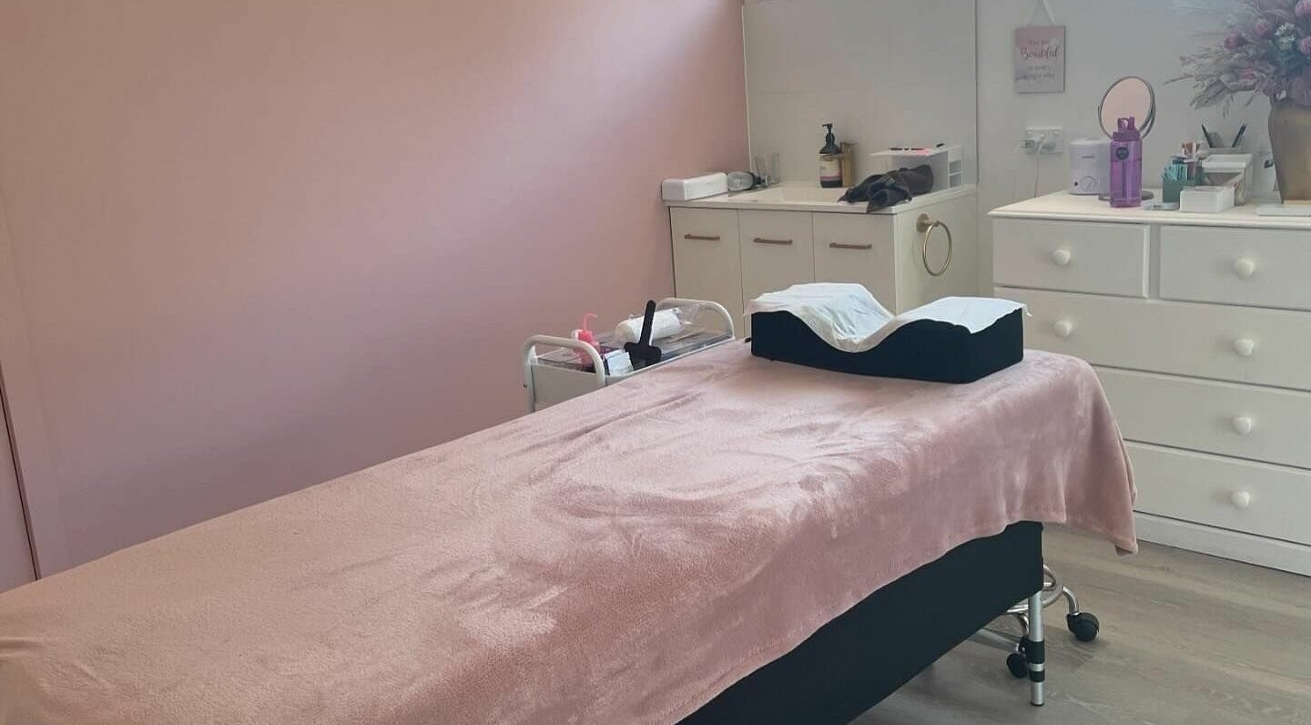 Relaxing treatment room at Crown of Glow Beauty, Cardigan, Victoria, AU with a plush pink blanket on the table.