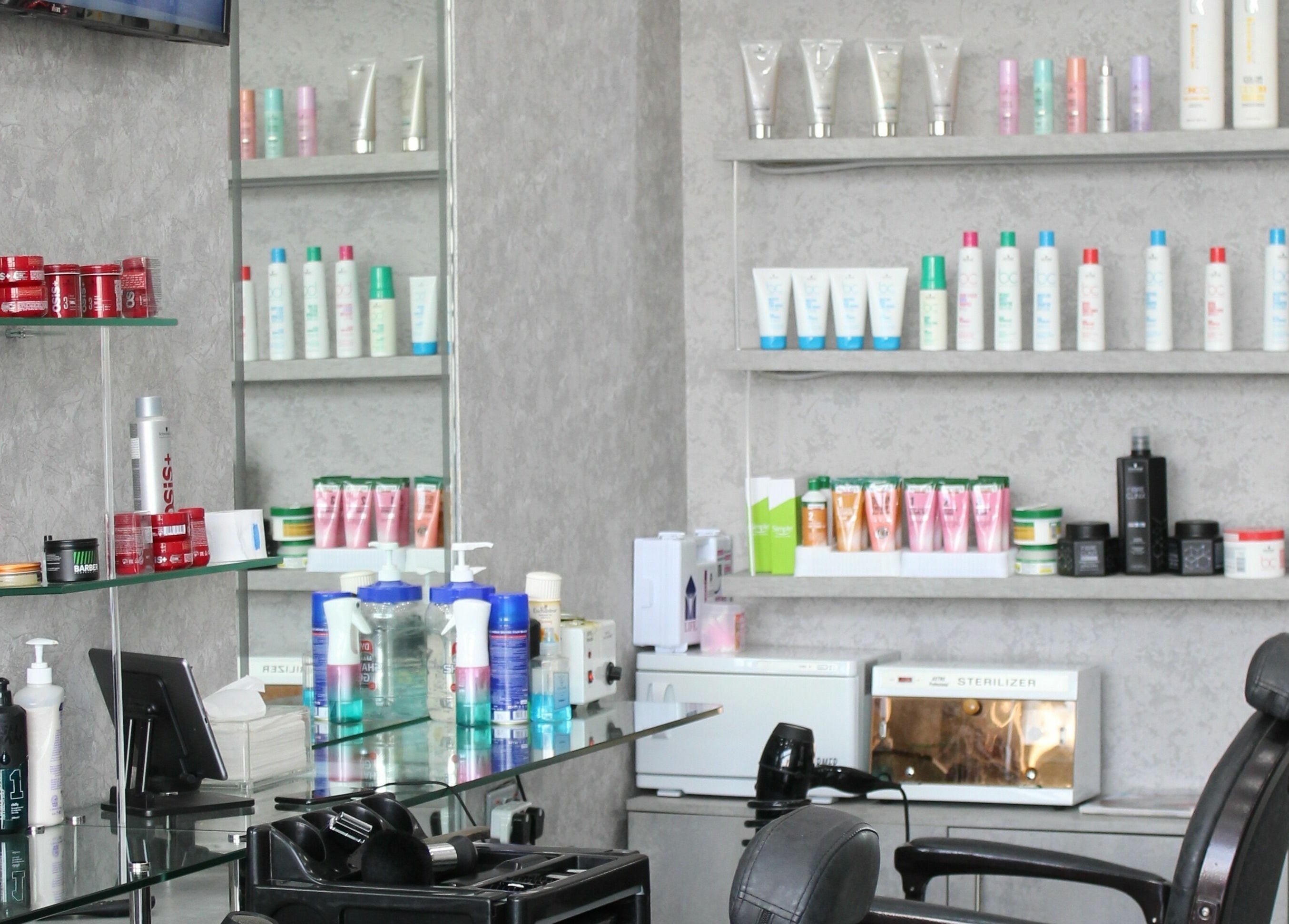 Grooming products displayed at Barber Bro Gents Salon, Dubai, AE, showcasing salon's stylish interior.