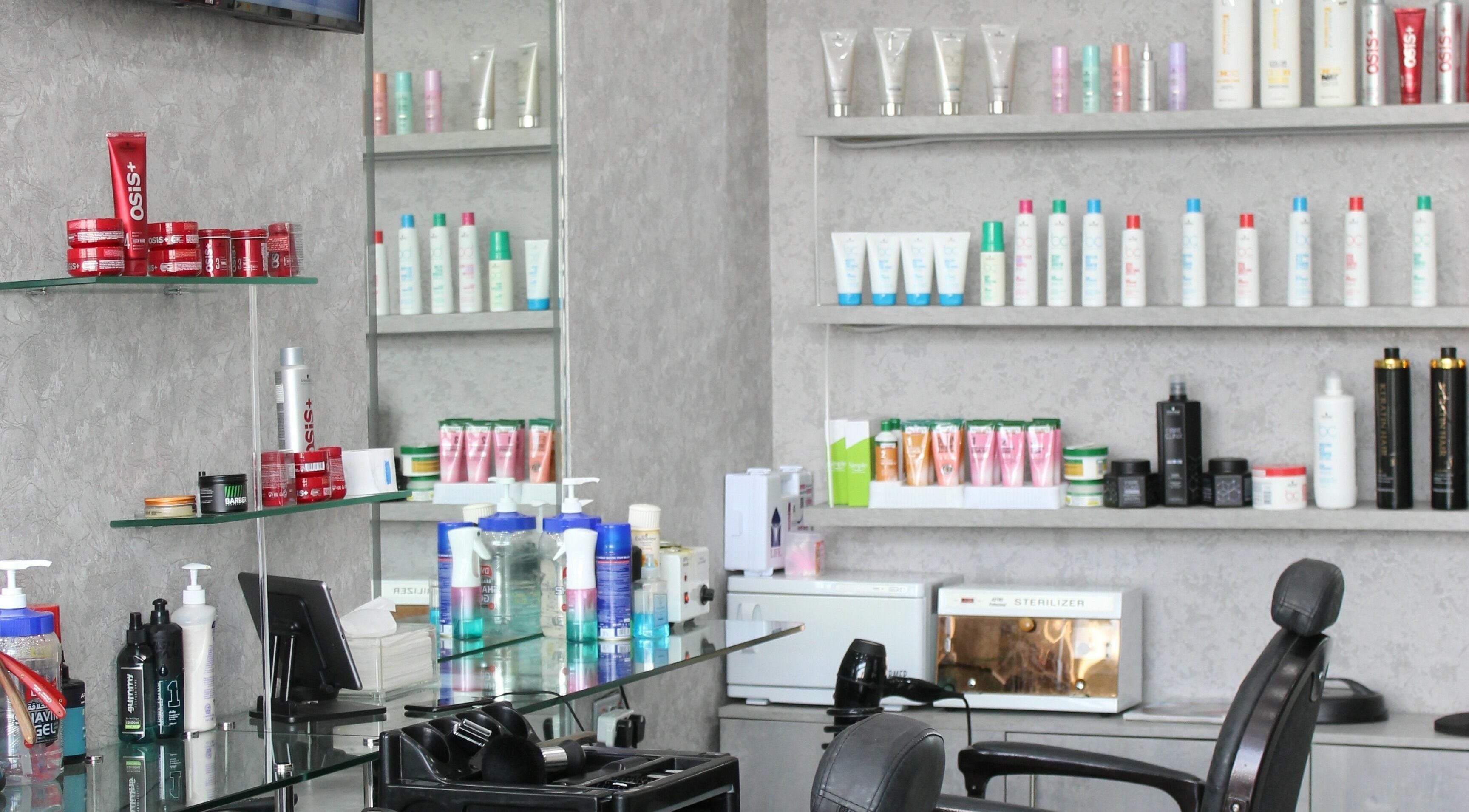 Grooming products displayed at Barber Bro Gents Salon, Dubai, AE, showcasing salon's stylish interior.