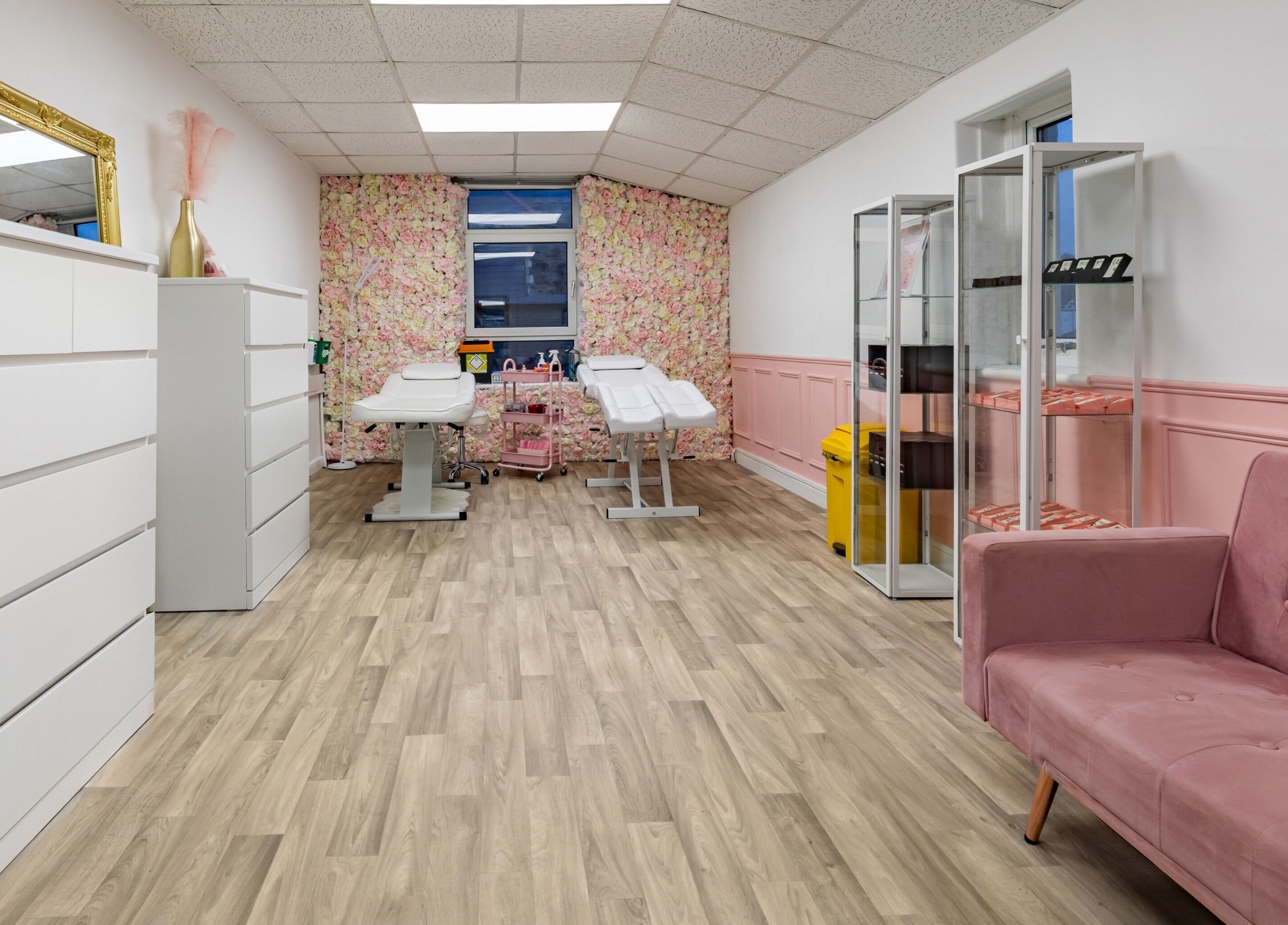 Elegant interior of Luxe Beautè in Cardiff, Wales, GB with pink accents and comfortable treatment spaces.