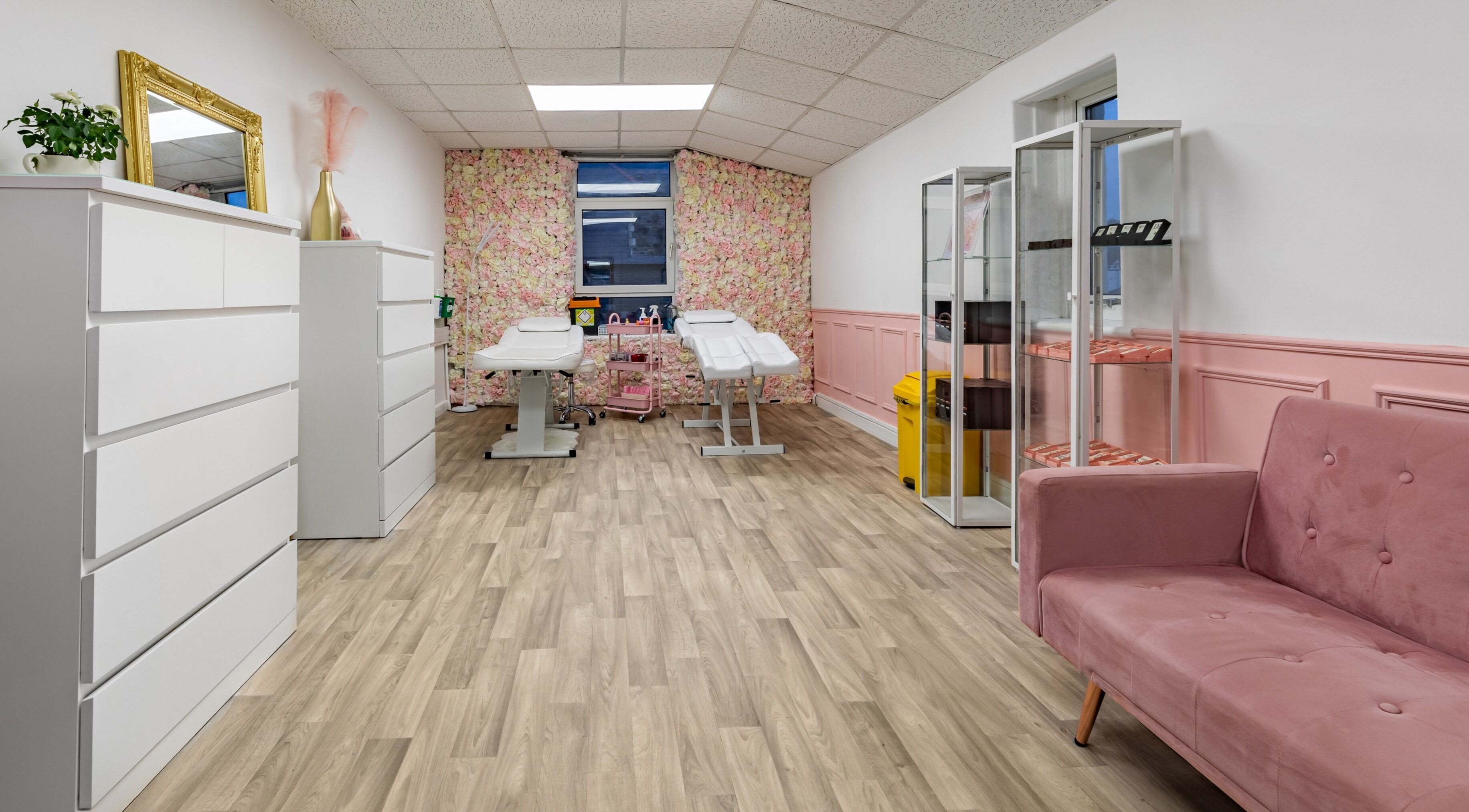 Elegant interior of Luxe Beautè in Cardiff, Wales, GB with pink accents and comfortable treatment spaces.