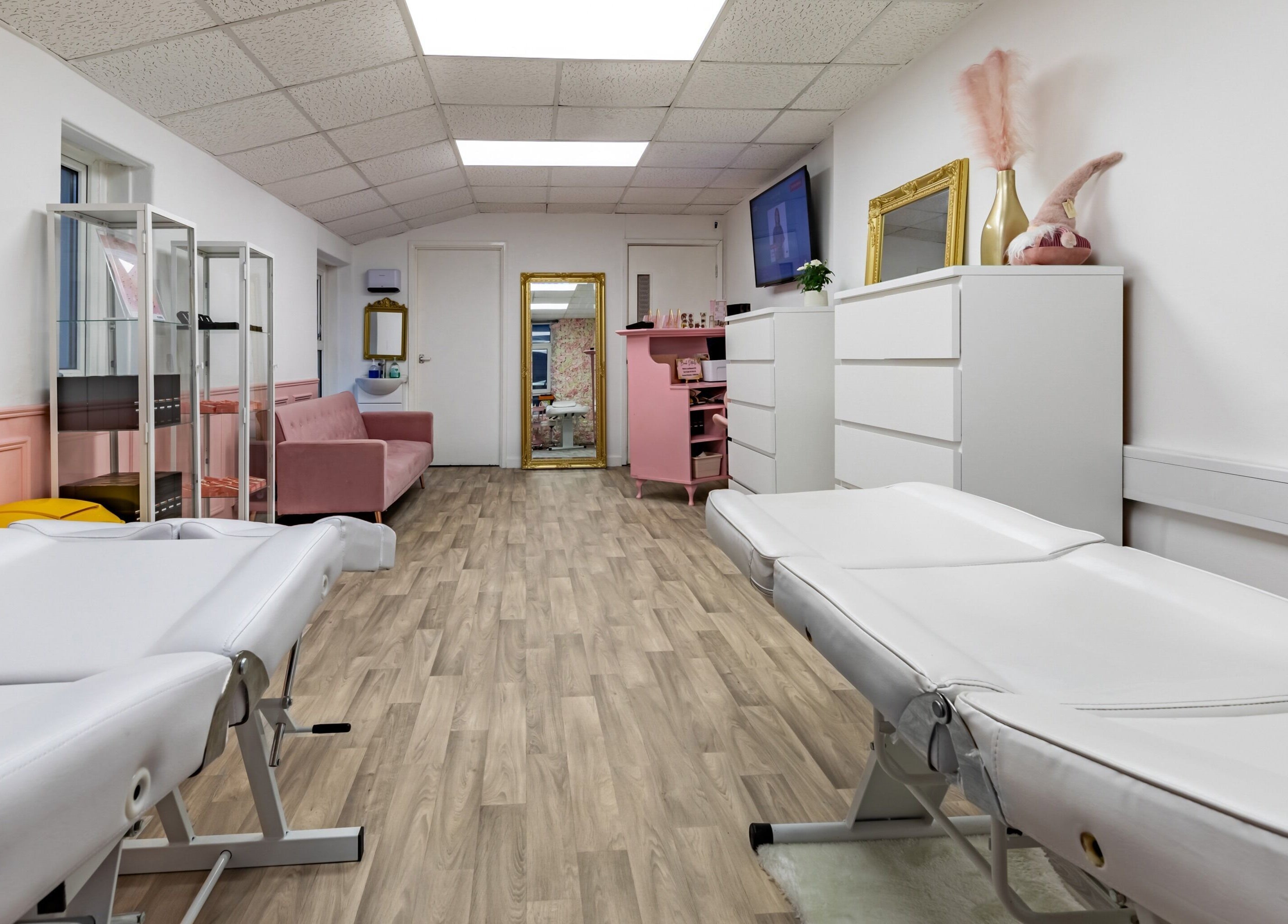 Luxe Beautè spa room with massage tables and elegant decor in Cardiff, Wales, GB.