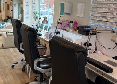 Modern nail salon interior at Queen Nails, Hull, England, GB, showcasing sleek design and comfort.