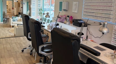 Modern nail salon interior at Queen Nails, Hull, England, GB, showcasing sleek design and comfort.