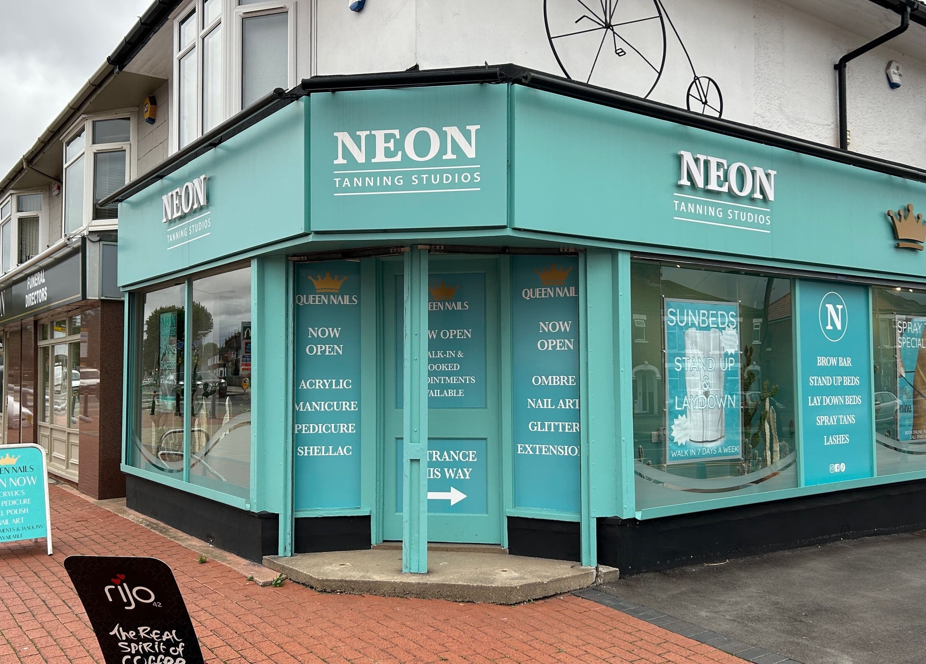 Queen Nails storefront in Hull, England, GB offering manicures, pedicures, and more in a vibrant setting.