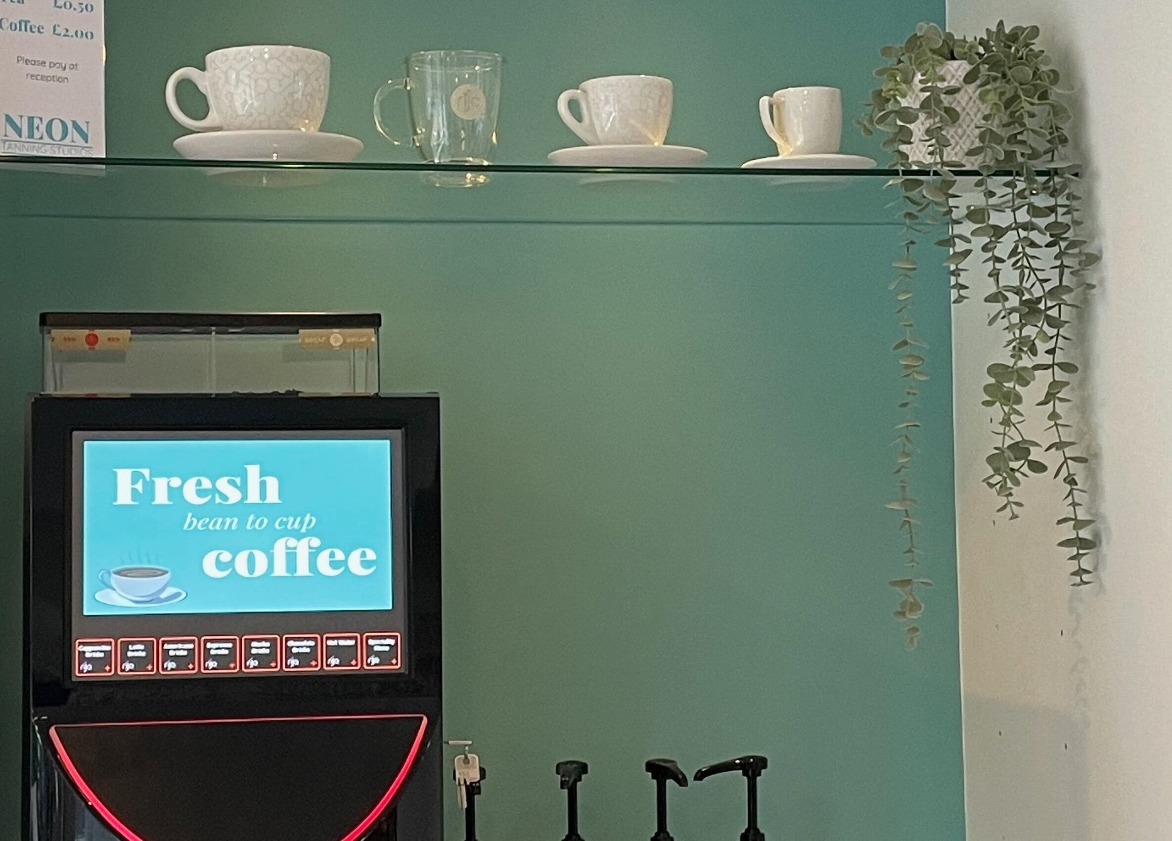 Coffee machine and cups at Queen Nails, Hull, England, GB enhancing the relaxing ambiance.