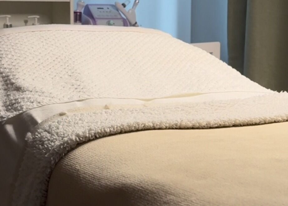 Relaxing treatment bed at After Glow by Liv, Worsley, England, GB offers ultimate comfort.