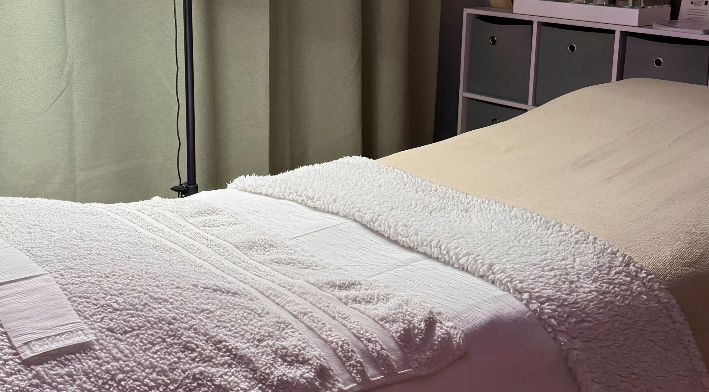 Cozy treatment bed at After Glow by Liv in Worsley, England, GB.