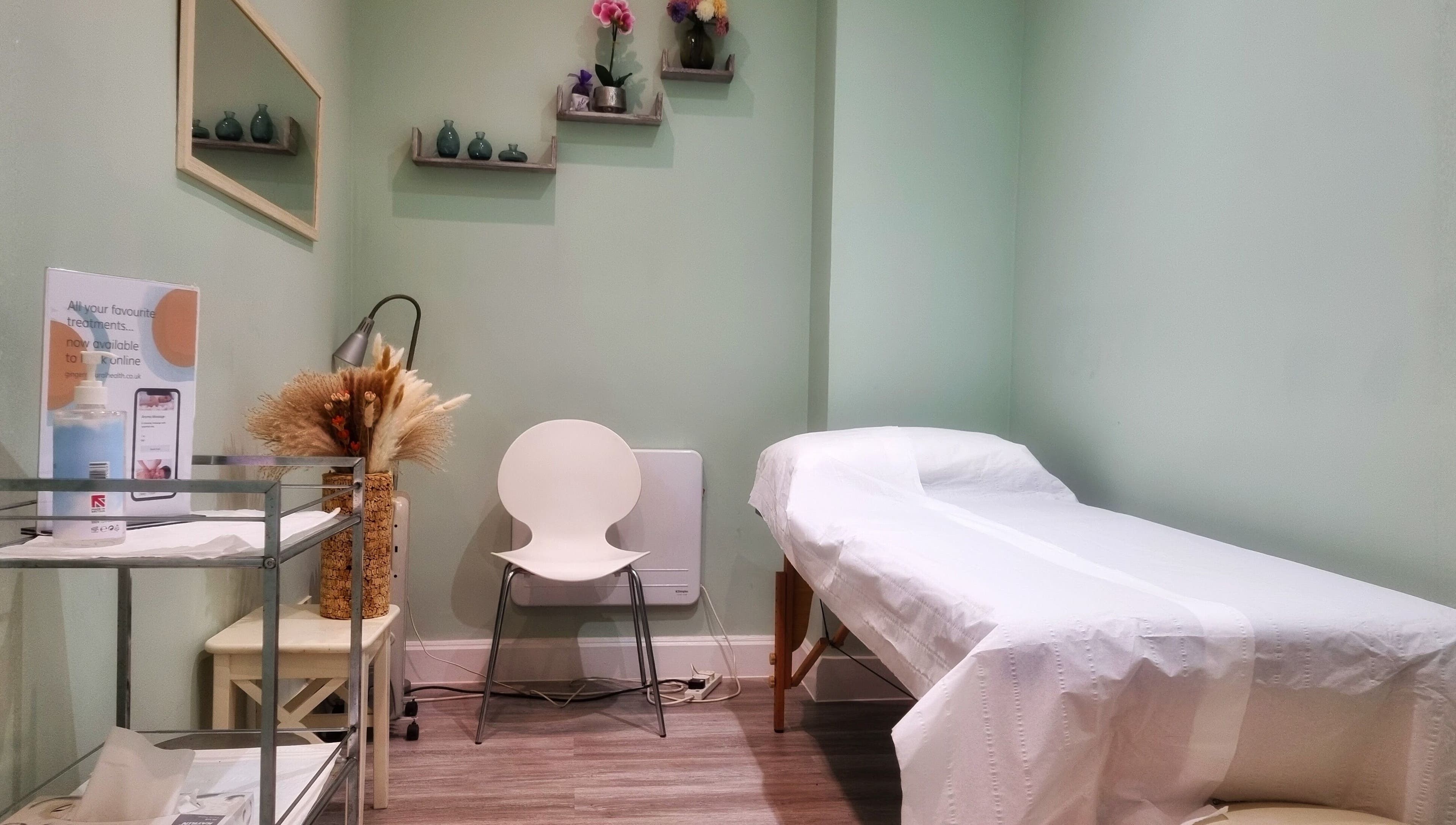 Calming therapy room at Ginger Natural Health, St Albans, England, GB, featuring treatment bed and soothing décor.