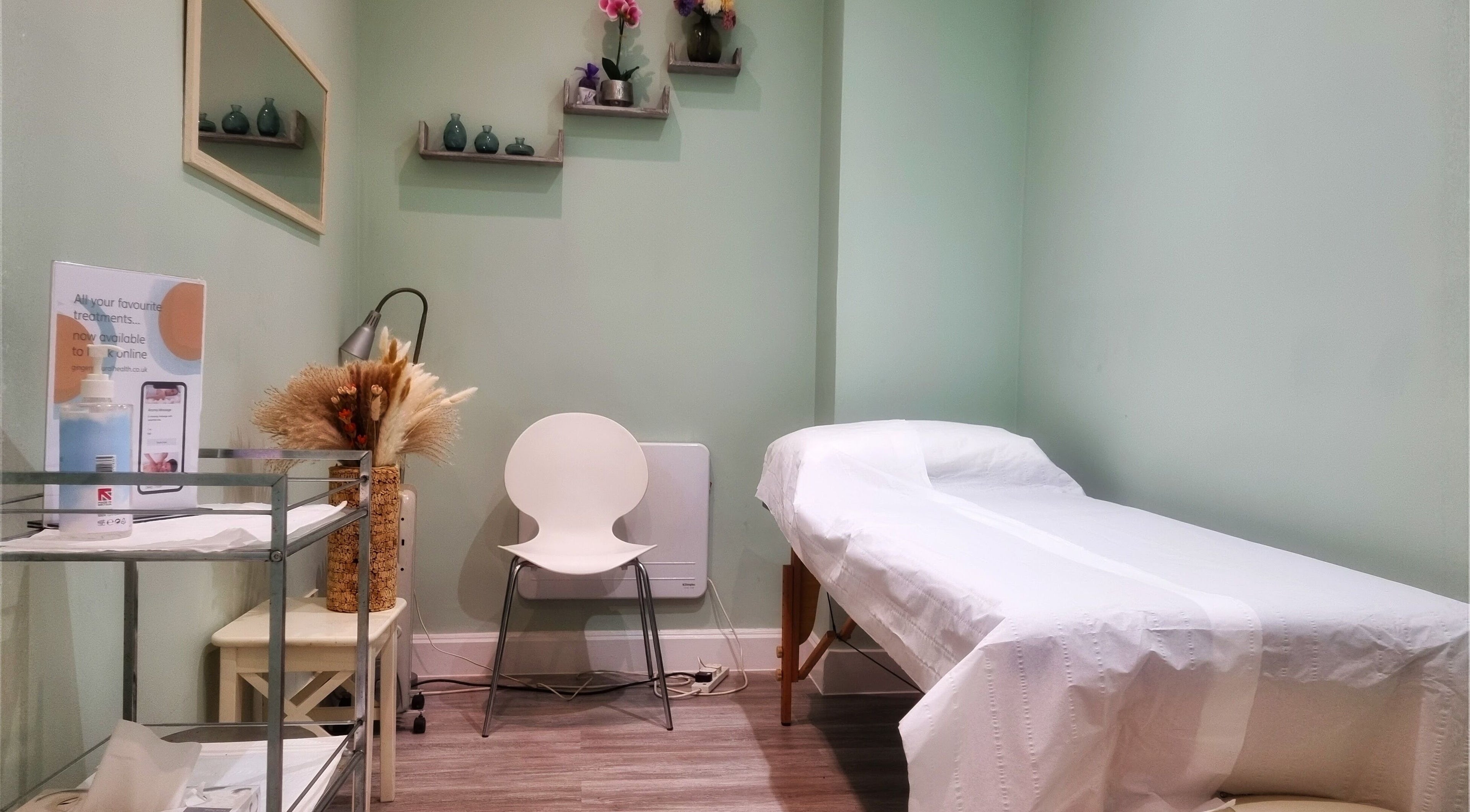 Calming therapy room at Ginger Natural Health, St Albans, England, GB, featuring treatment bed and soothing décor.