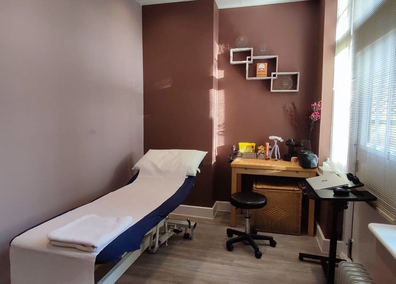 A serene treatment room at Ginger Natural Health in St Albans, England, GB, featuring a treatment bed and soft lighting.