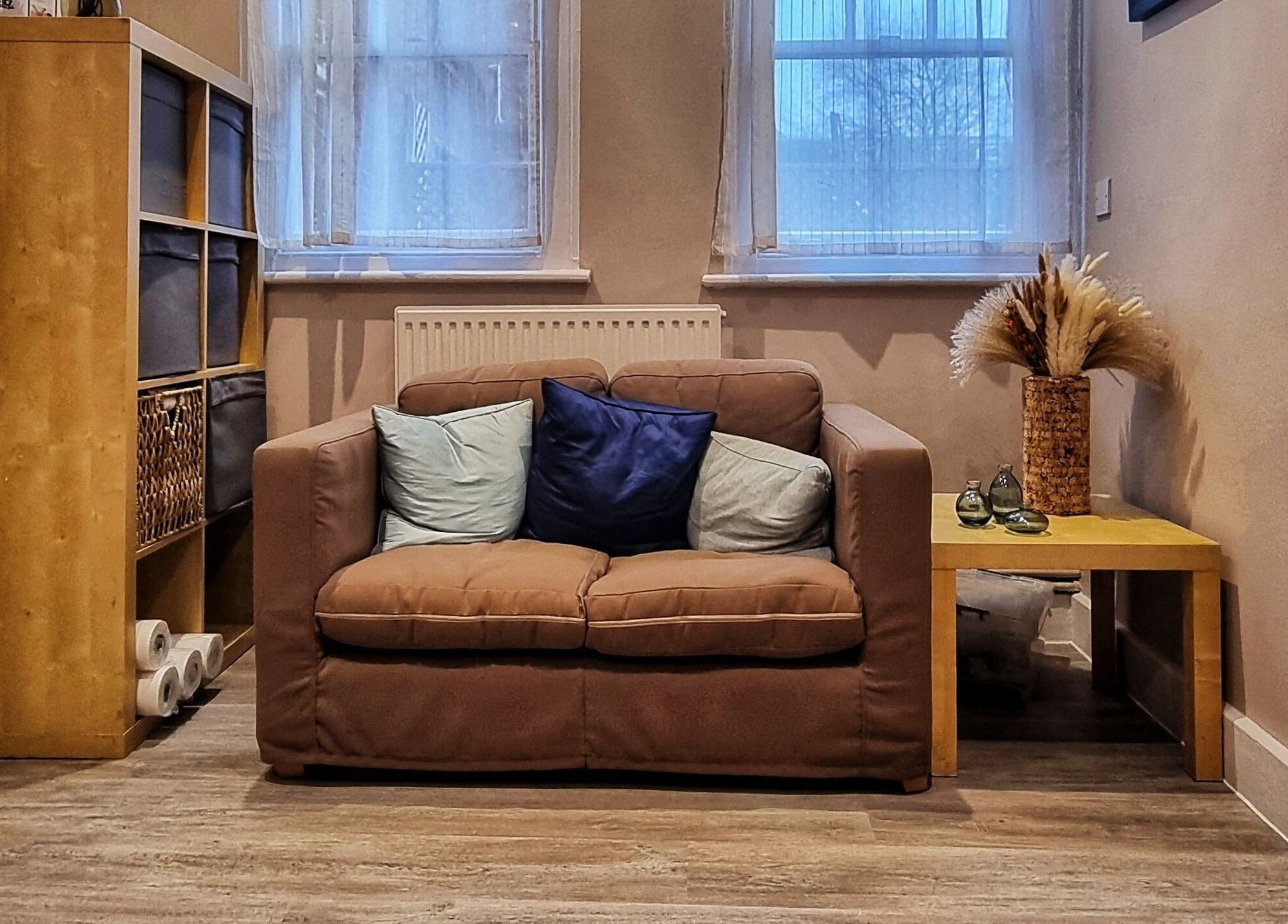 Comfortable seating area at Ginger Natural Health, St Albans, England, GB, featuring a sofa and decor.
