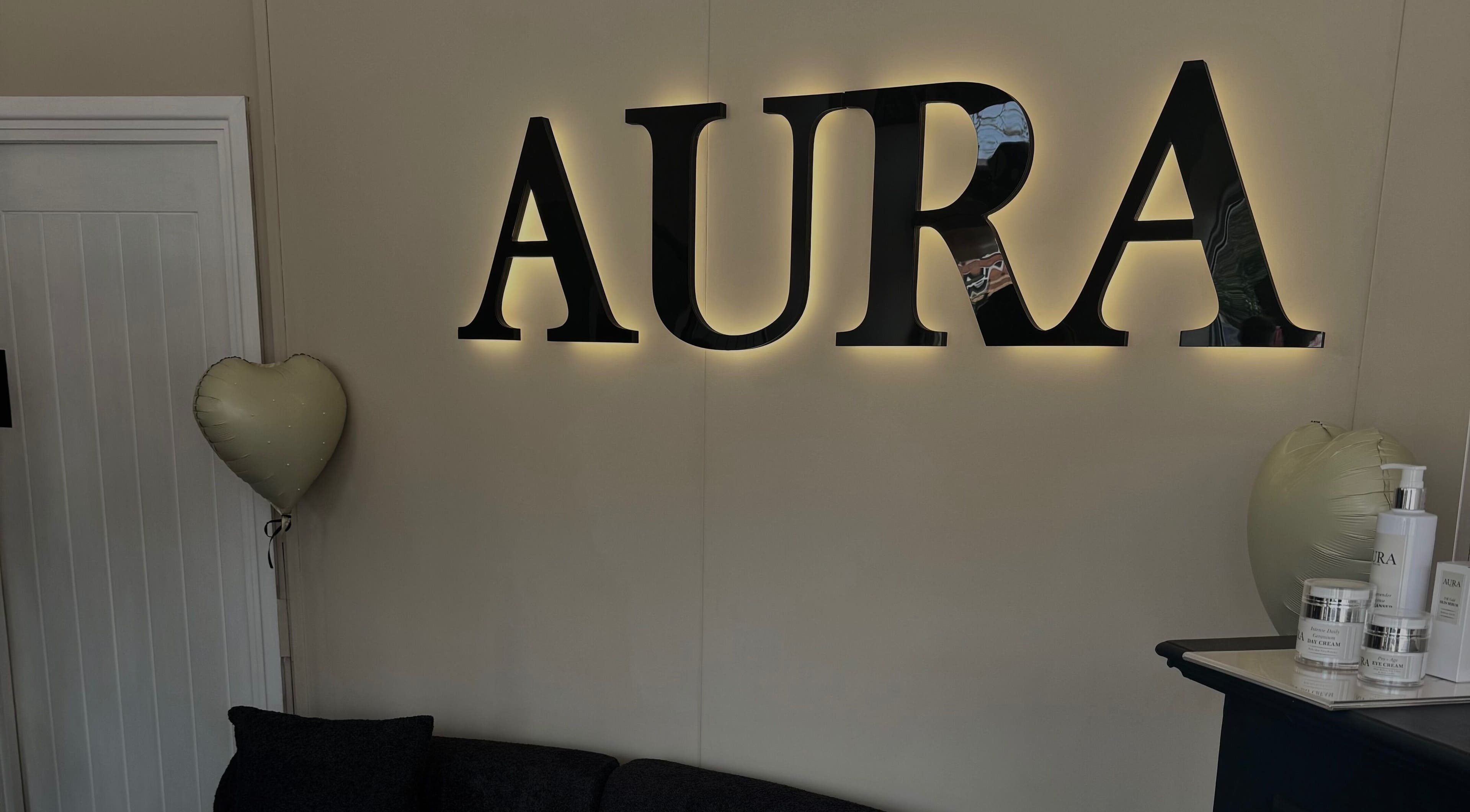 Illuminated Aura wall sign at By Paris Warren, Hucknall, England, GB. Heart balloon and products on display.