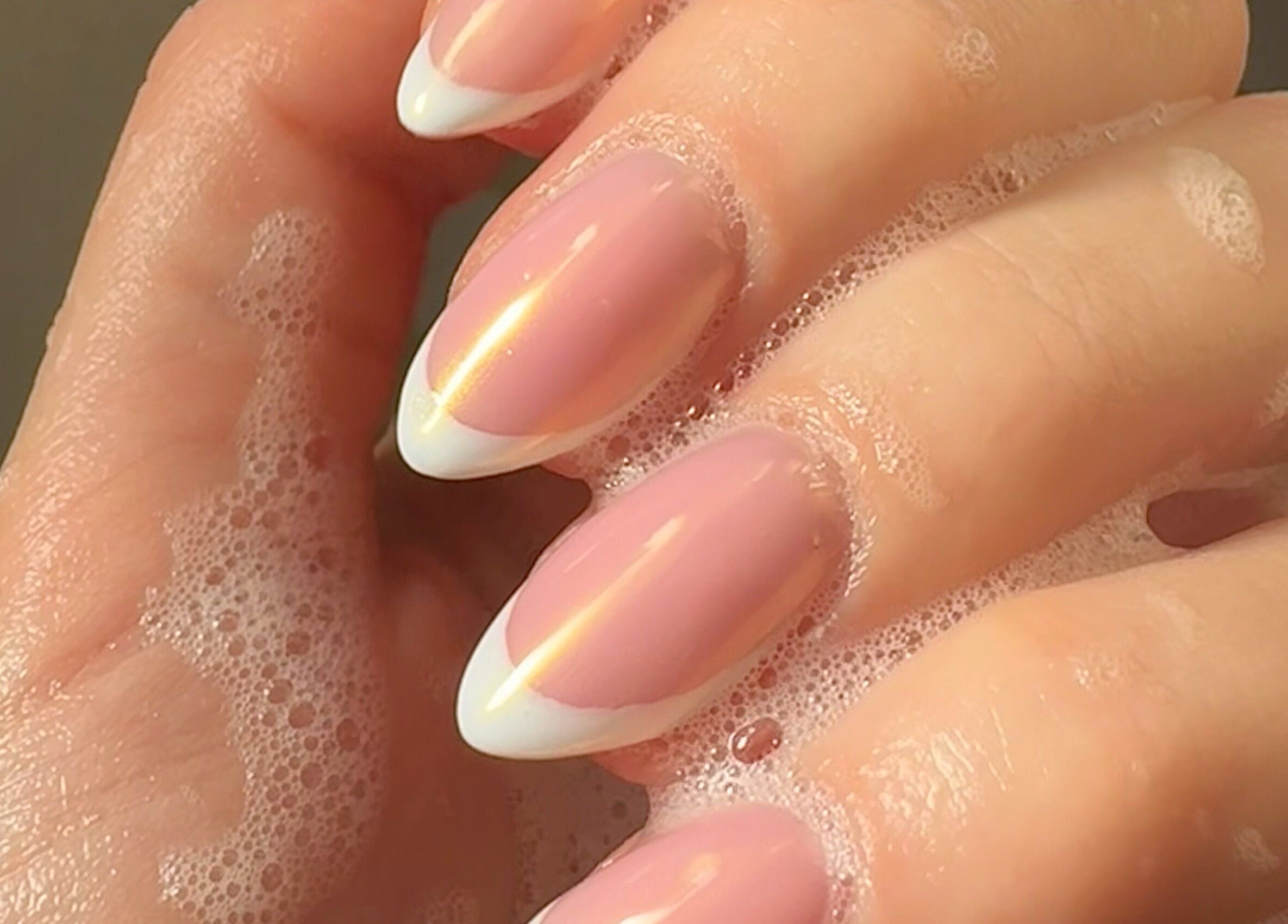 Chic French manicure with soap bubbles at By Paris Warren, Hucknall, England, GB for elegant nail care.