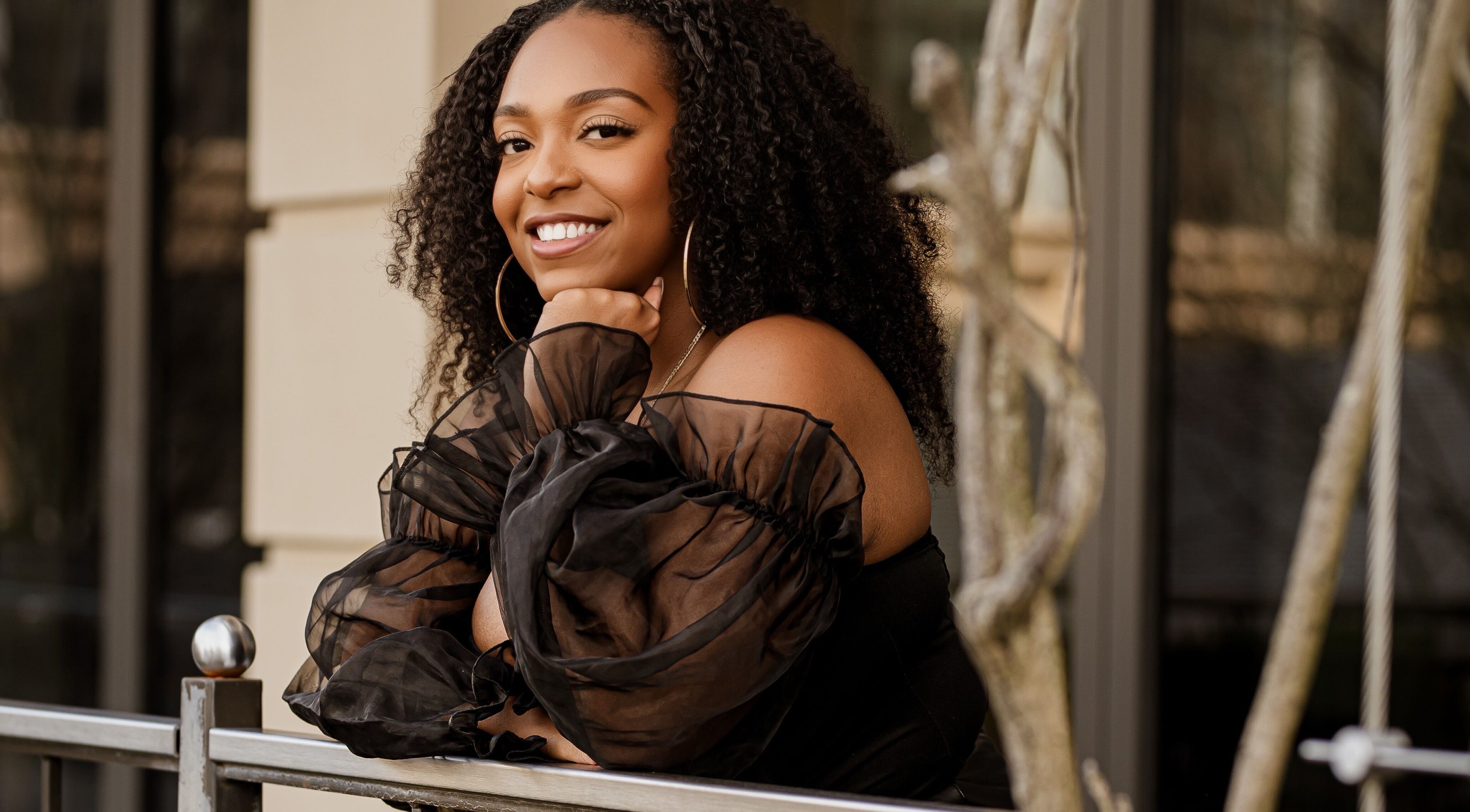 Smiling woman outside The Cosmoholic Skin Treatment Studio, Brookhaven, Georgia, US.