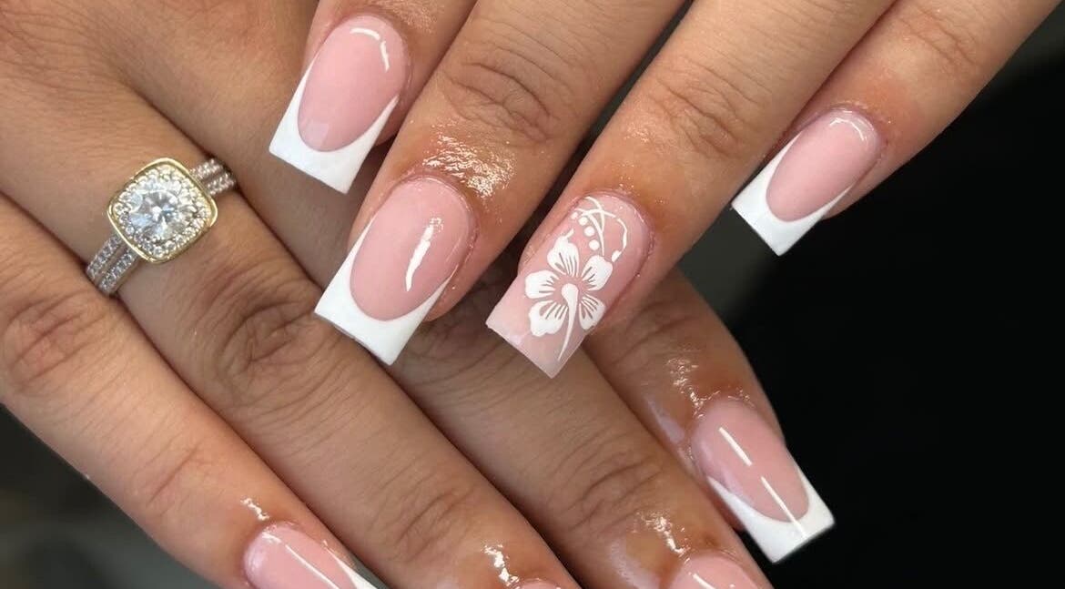Elegant French manicure with floral detail at La Bella Beauty, Rotherham, England, GB.