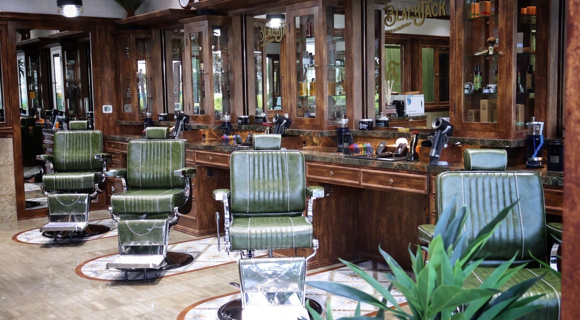 Elegant vintage barber chairs at Black Jack Dubai Hills, دبي, دبي, AE, offering luxury grooming services.