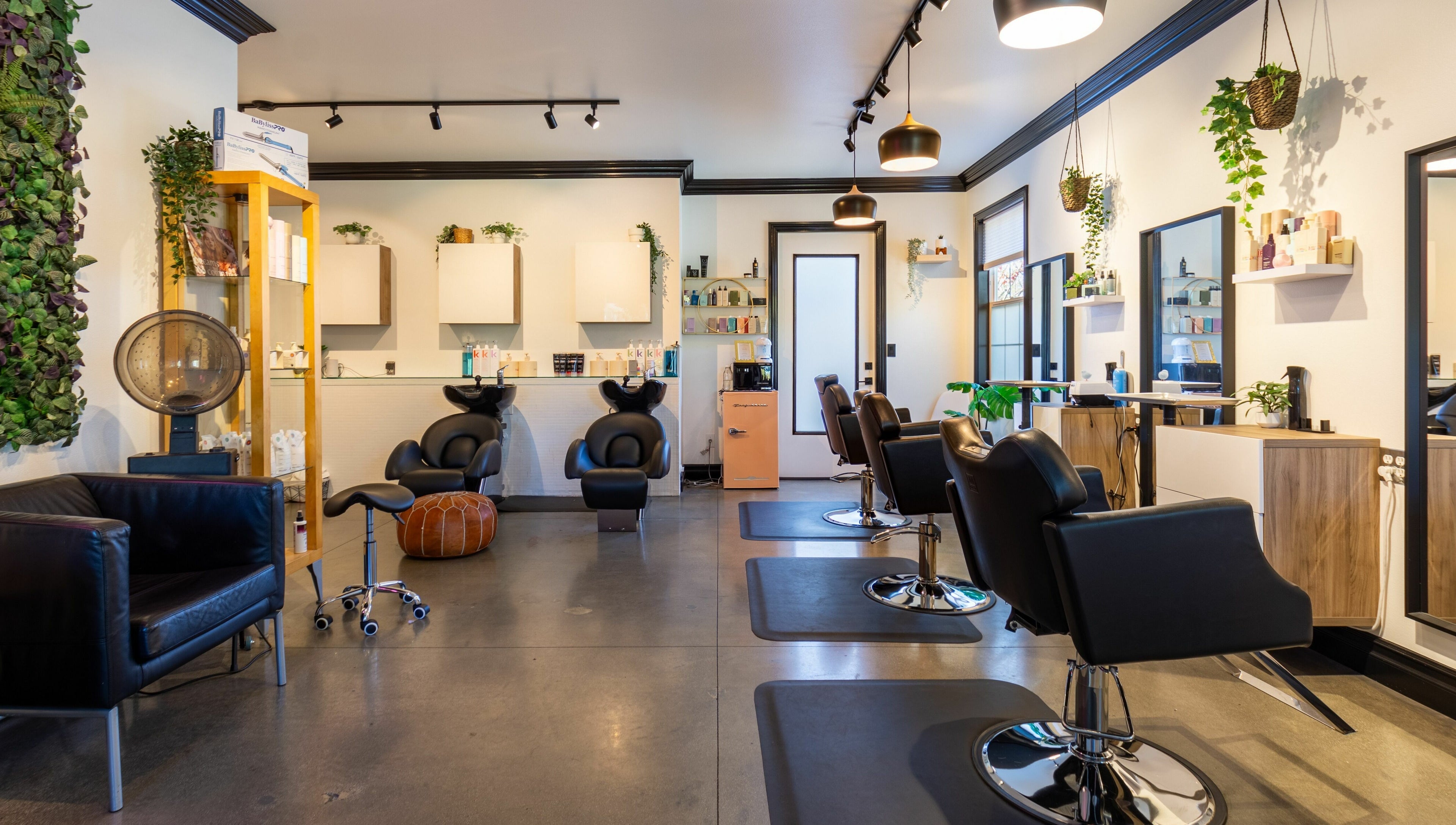 Elegant interior of Red Door Salon with Aimee, Ladera Ranch, California, featuring stylish salon chairs.