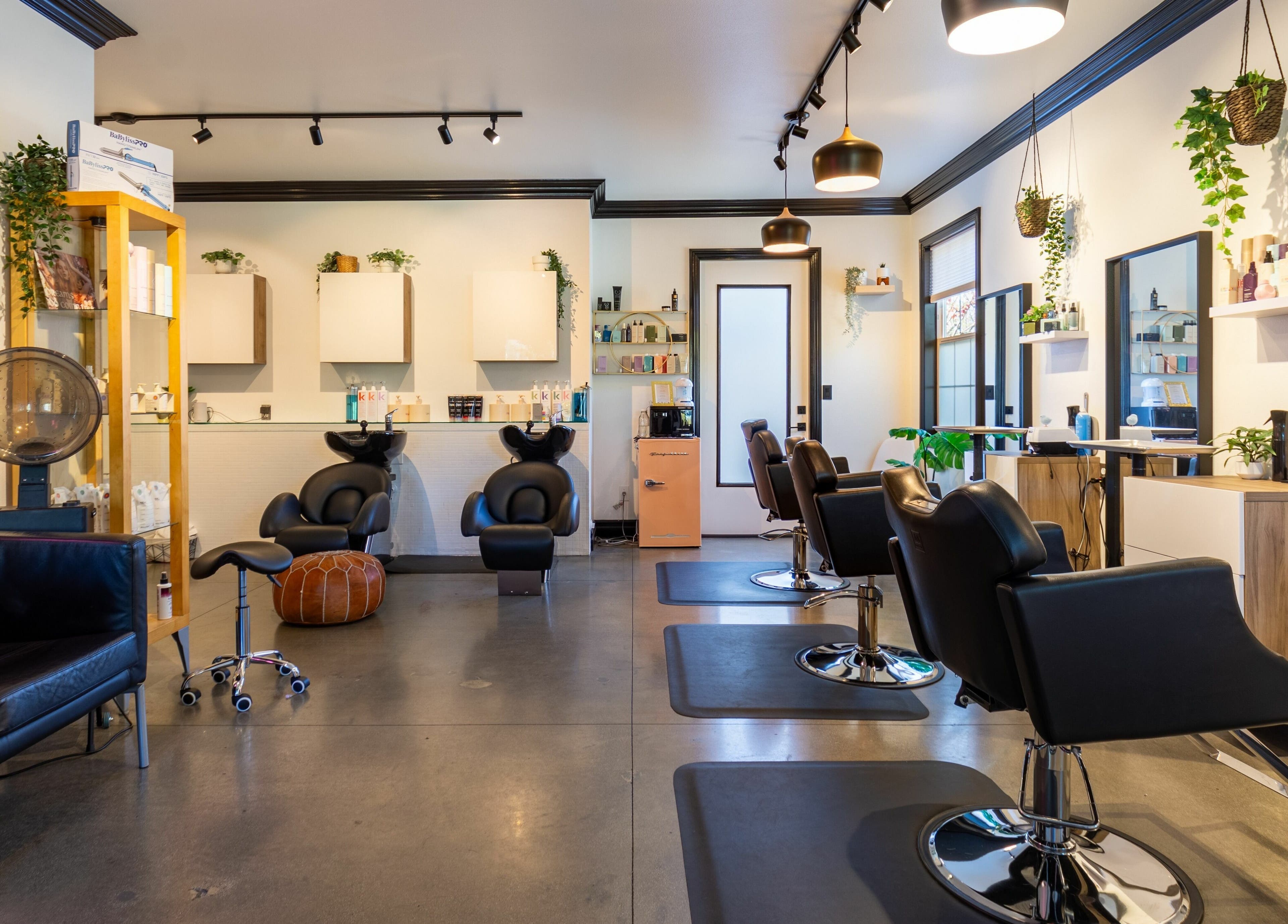 Elegant interior of Red Door Salon with Aimee, Ladera Ranch, California, featuring stylish salon chairs.