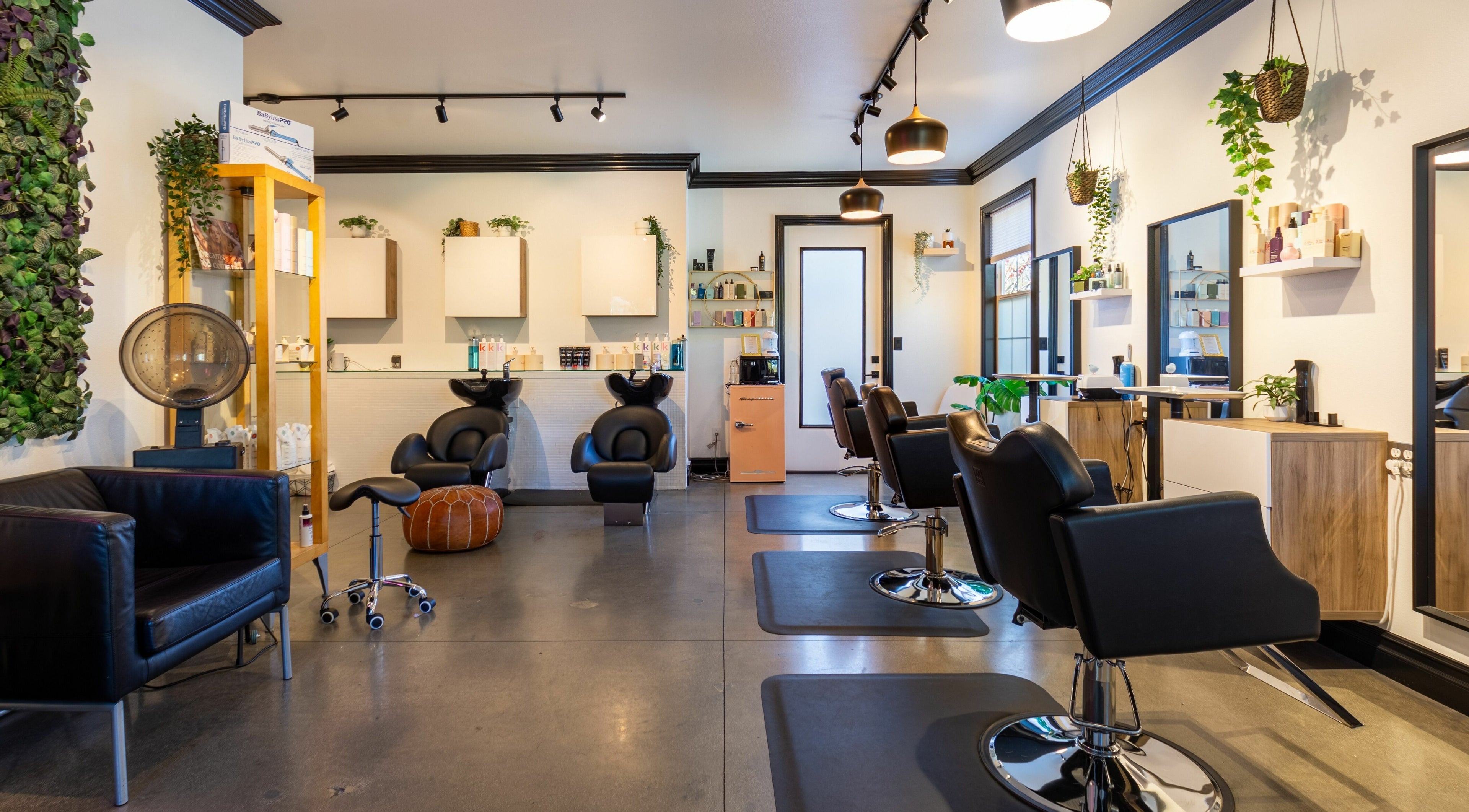 Elegant interior of Red Door Salon with Aimee, Ladera Ranch, California, featuring stylish salon chairs.
