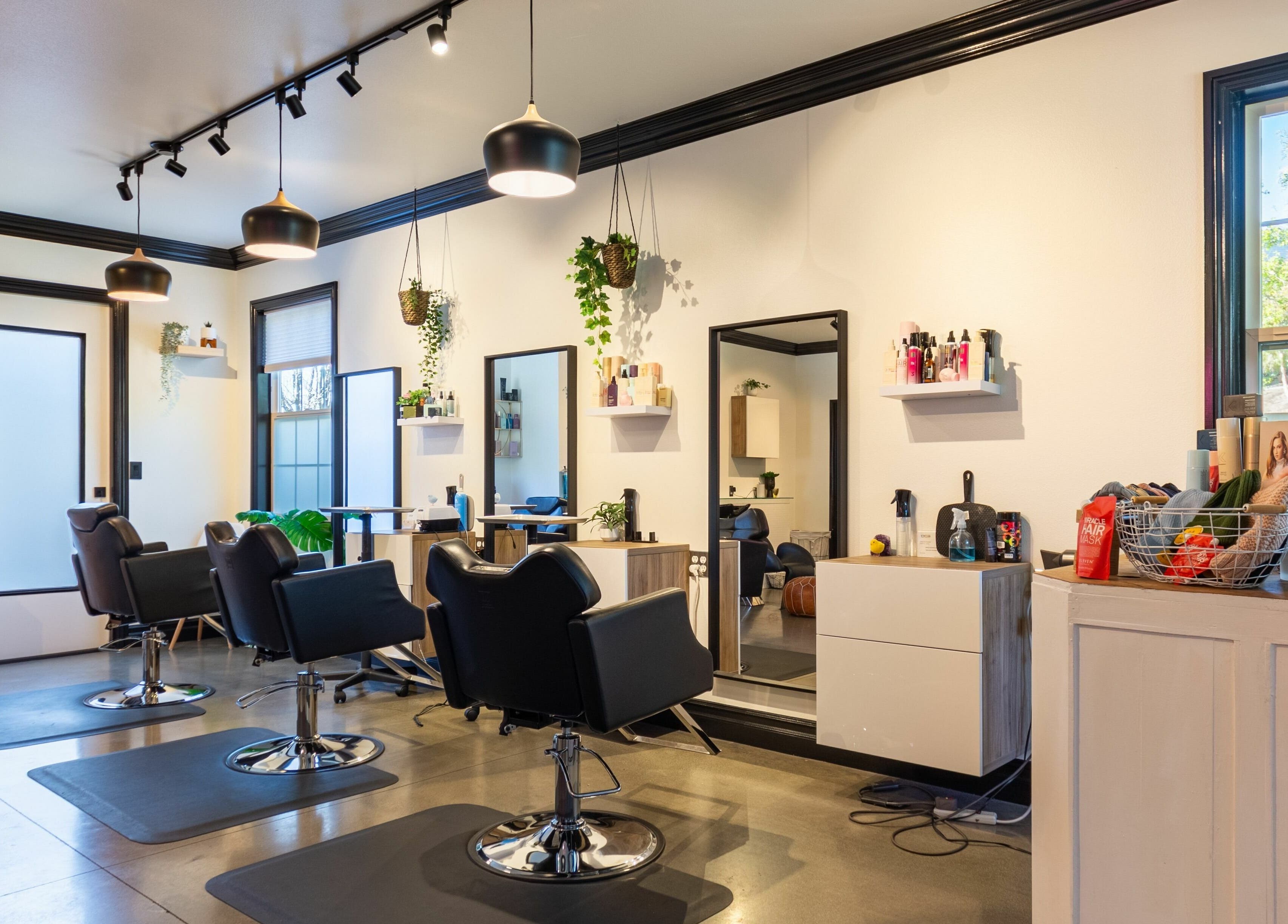 Modern interior of Red Door Salon with Aimee in Ladera Ranch, California, US, featuring stylish chairs and decor.