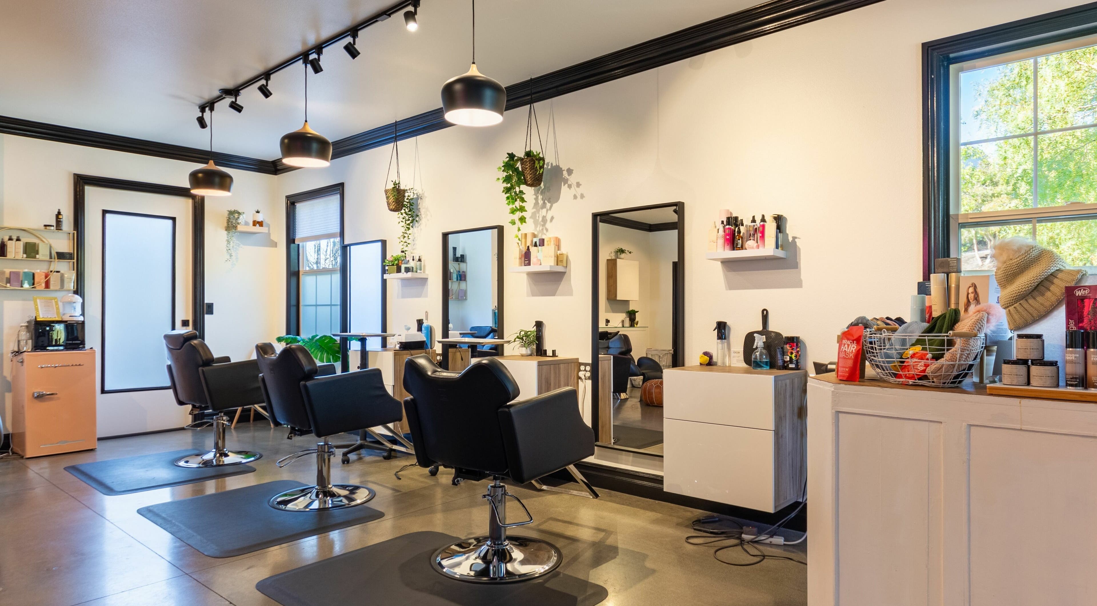 Modern interior of Red Door Salon with Aimee in Ladera Ranch, California, US, featuring stylish chairs and decor.