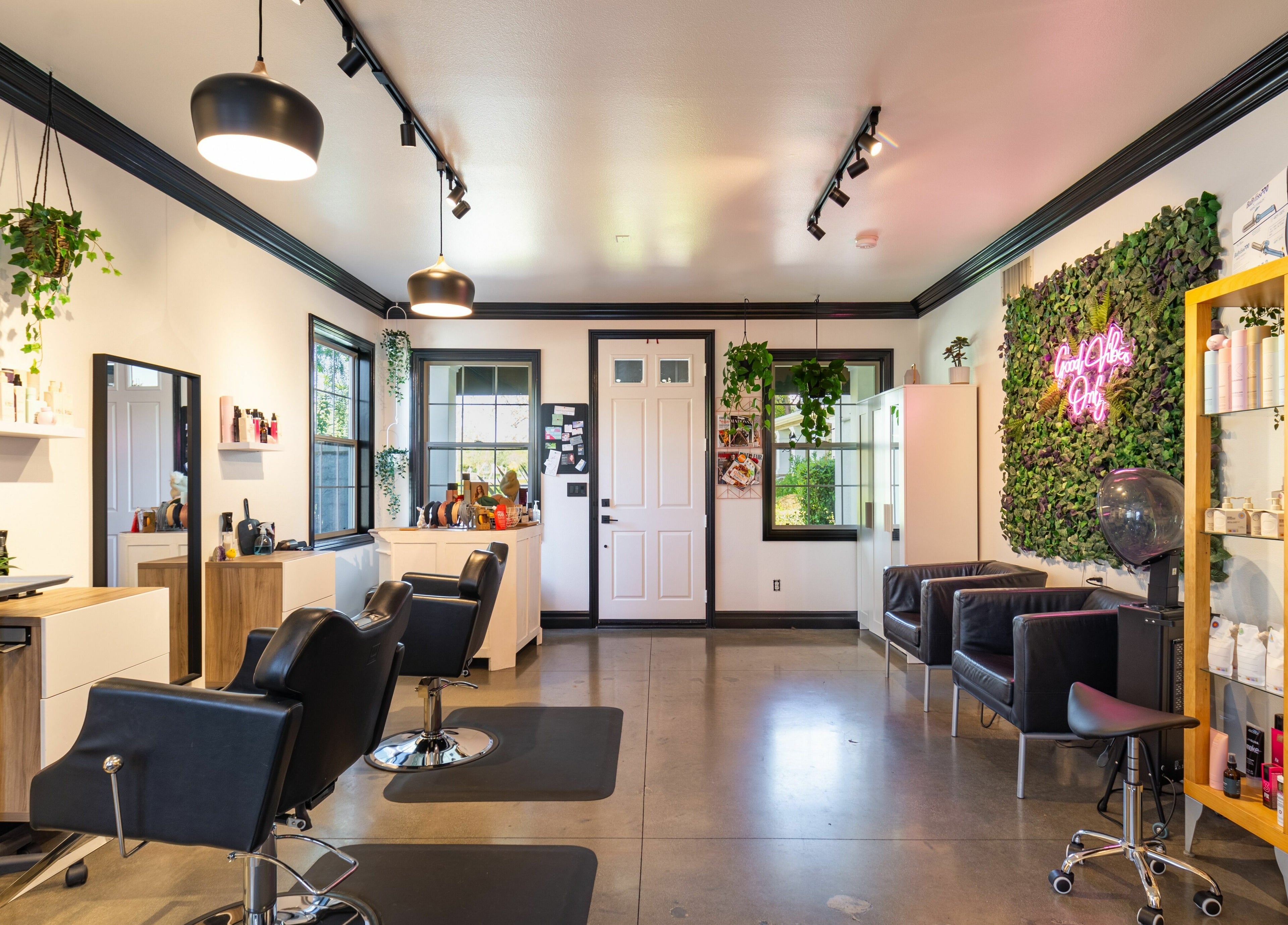Chic interior of Red Door Salon with Aimee in Ladera Ranch, California, US featuring stylish seating and decor.