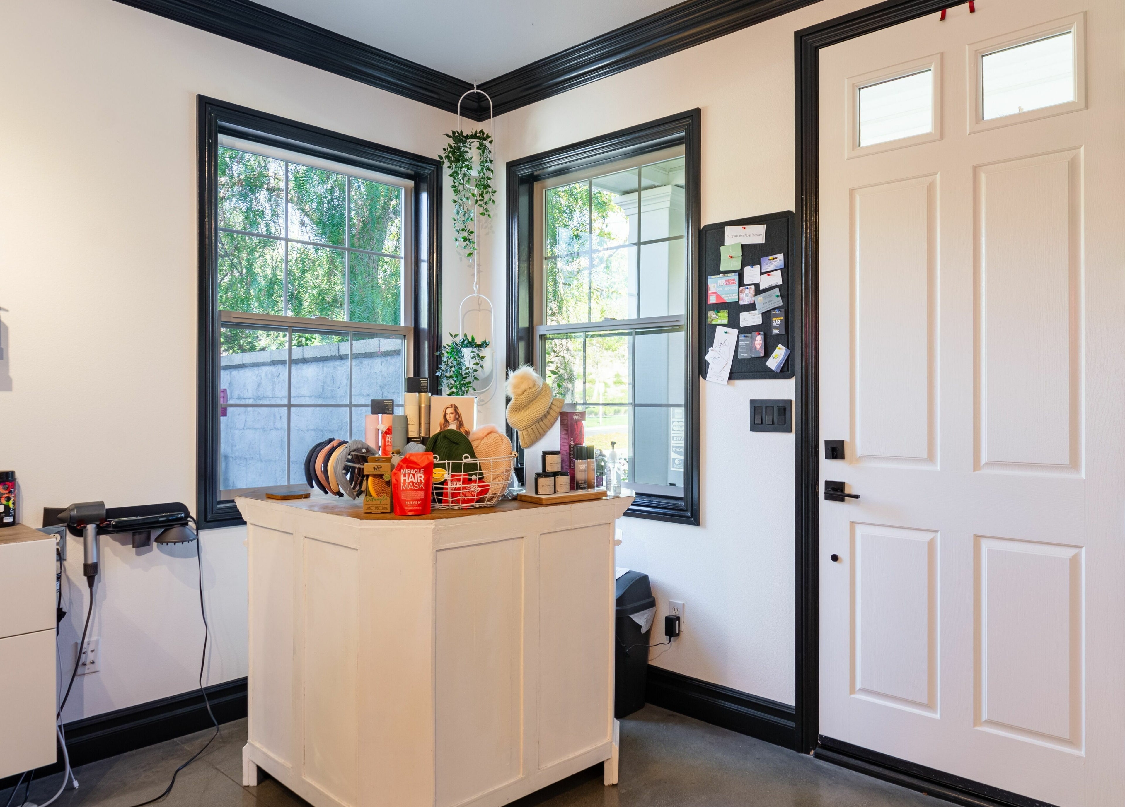 Chic entryway of Red Door Salon with Aimee in Ladera Ranch, California, US, showcasing products and decor.