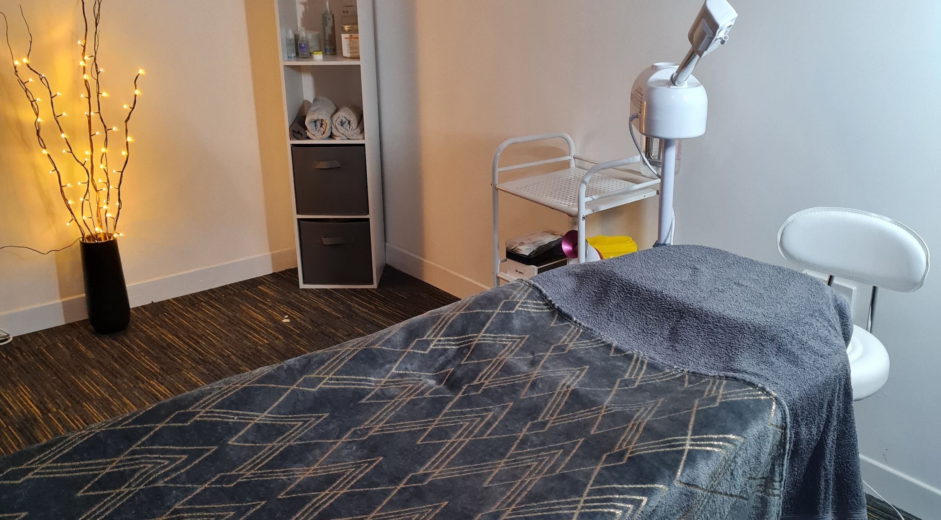 Tranquil spa treatment room at FAB, Norwich, England, GB with relaxing ambiance and modern equipment.