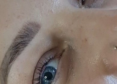 Close-up of serene eyes and eyebrows from FAB, Norwich, England, GB, showcasing beauty treatment results.