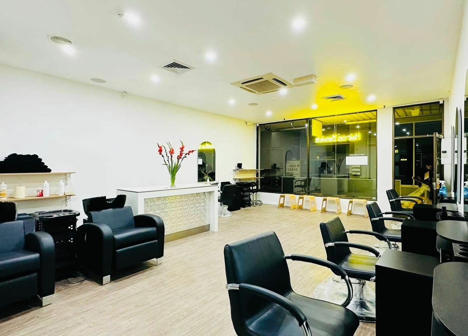 Modern salon interior at Hair On Berwick, Casey, Victoria, AU with sleek chairs and stylish décor.