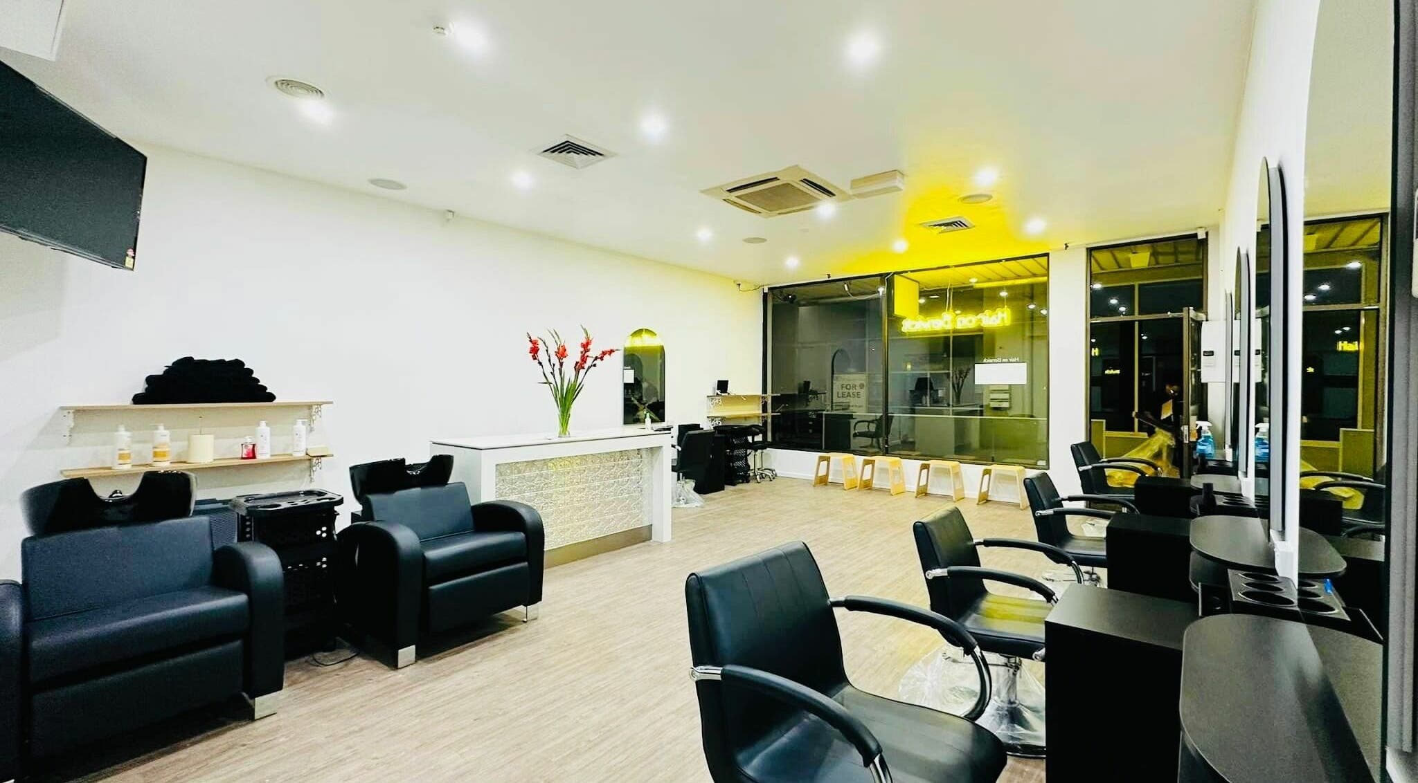 Modern salon interior at Hair On Berwick, Casey, Victoria, AU with sleek chairs and stylish décor.