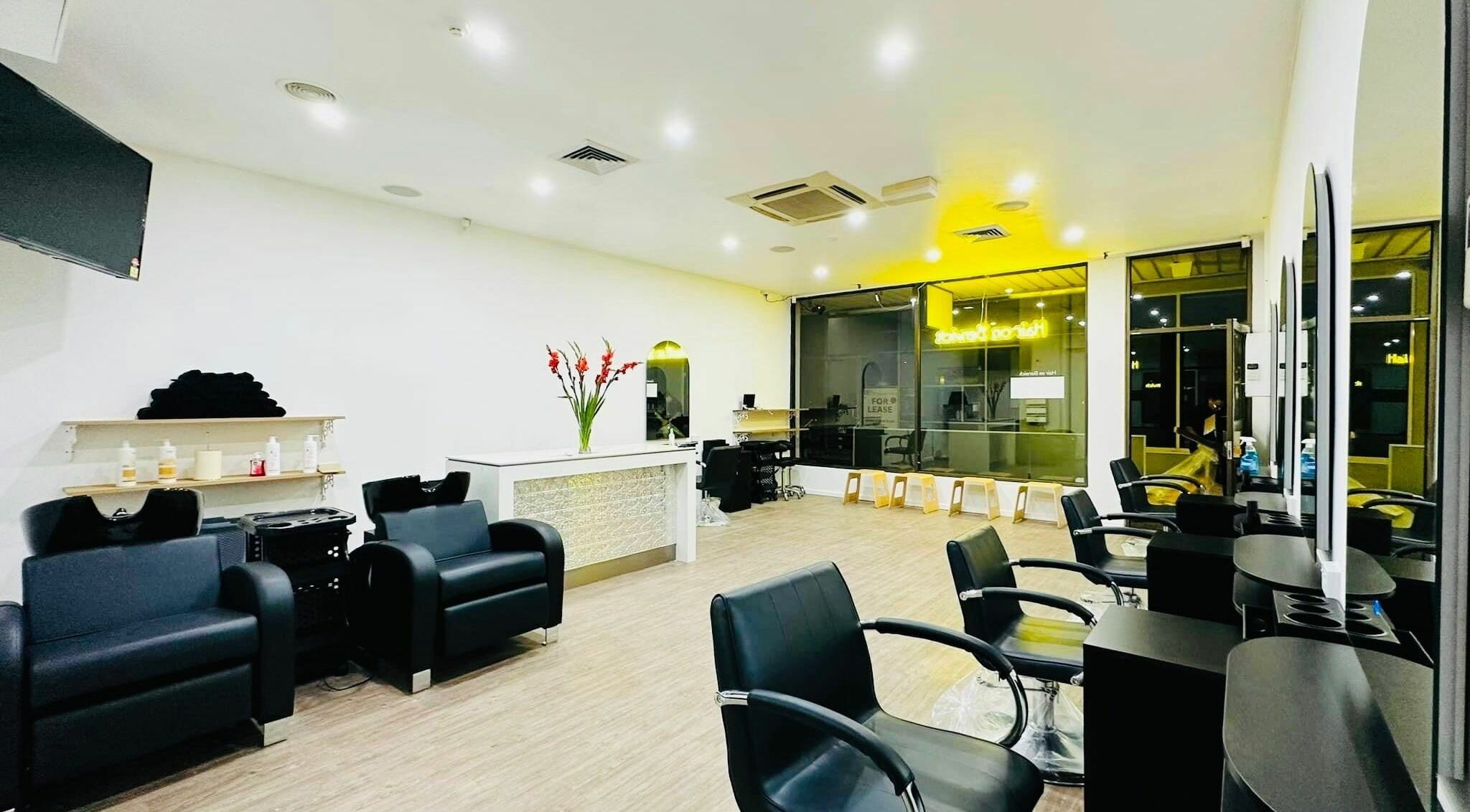 Modern salon interior at Hair On Berwick, Casey, Victoria, AU with sleek chairs and stylish décor.
