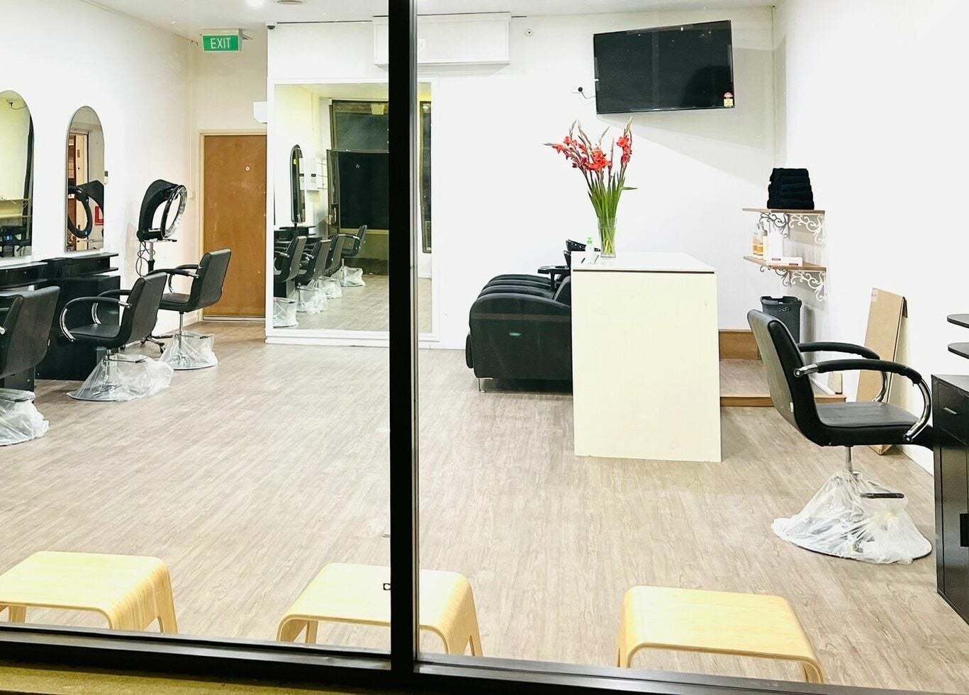 Modern interior of Hair On Berwick salon in Casey, Victoria, AU, featuring stylish chairs and mirrors.