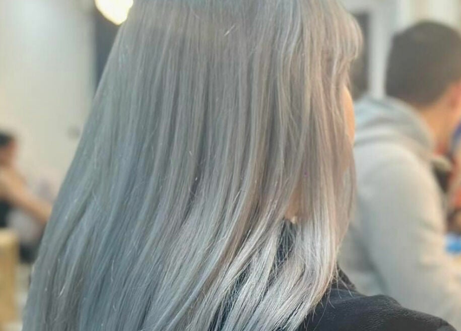 Back view of silver hair styled at Hair On Berwick in Casey, Victoria, AU. Sleek and glossy finish.