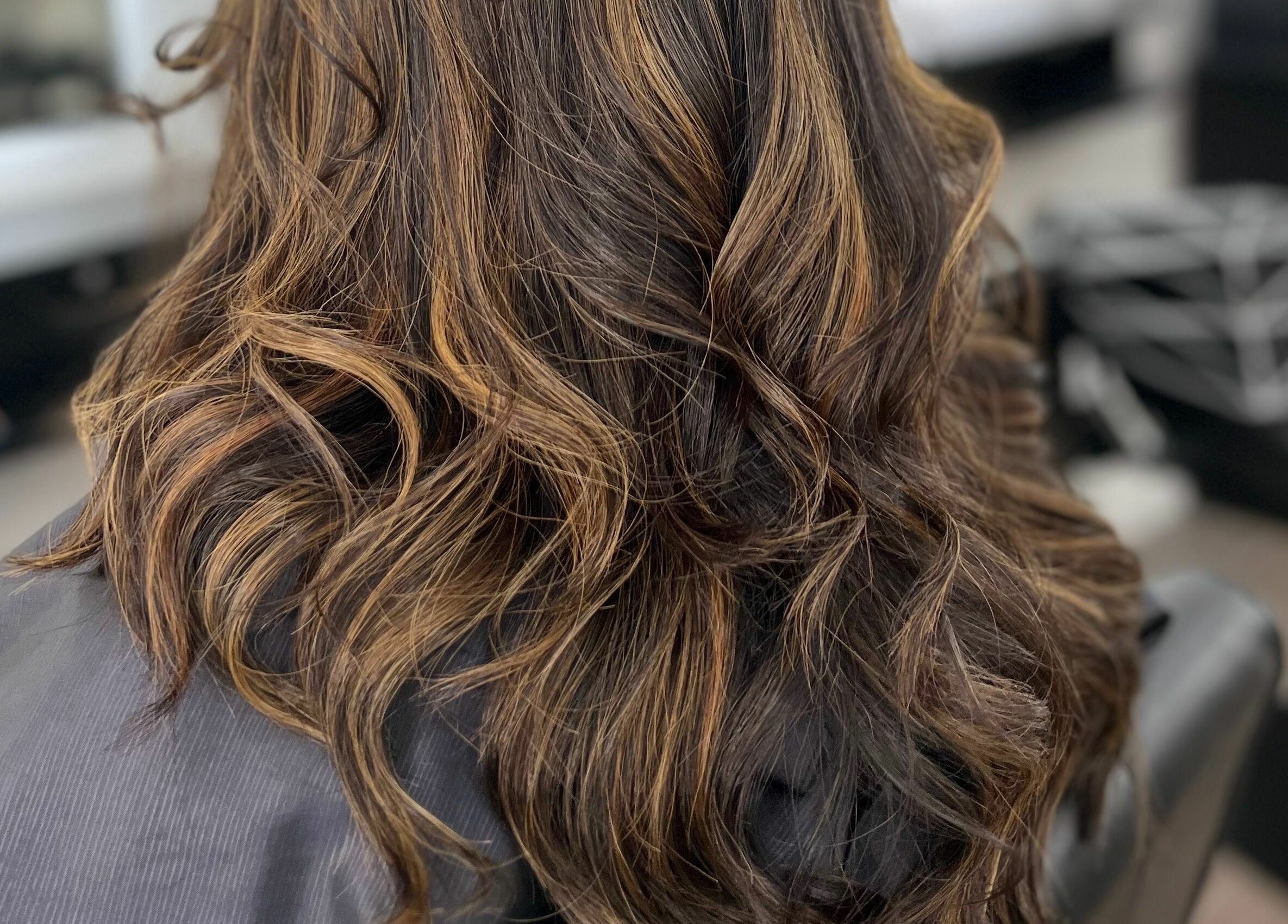 Close-up of elegant wavy hairstyle at Hair On Berwick in Casey, Victoria, AU.