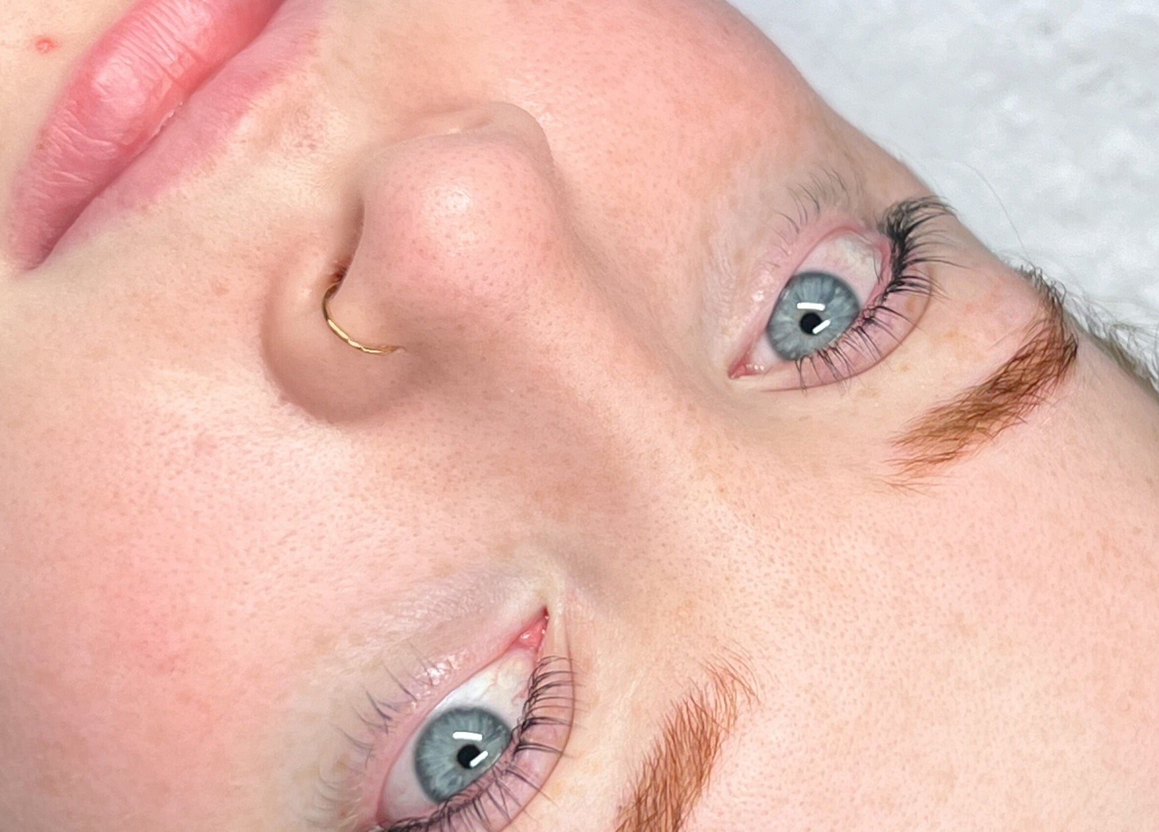 Close-up of a glowing face at Yuna Uchoa, Dublin, County Dublin, IE, showcasing clear skin and serene expression.