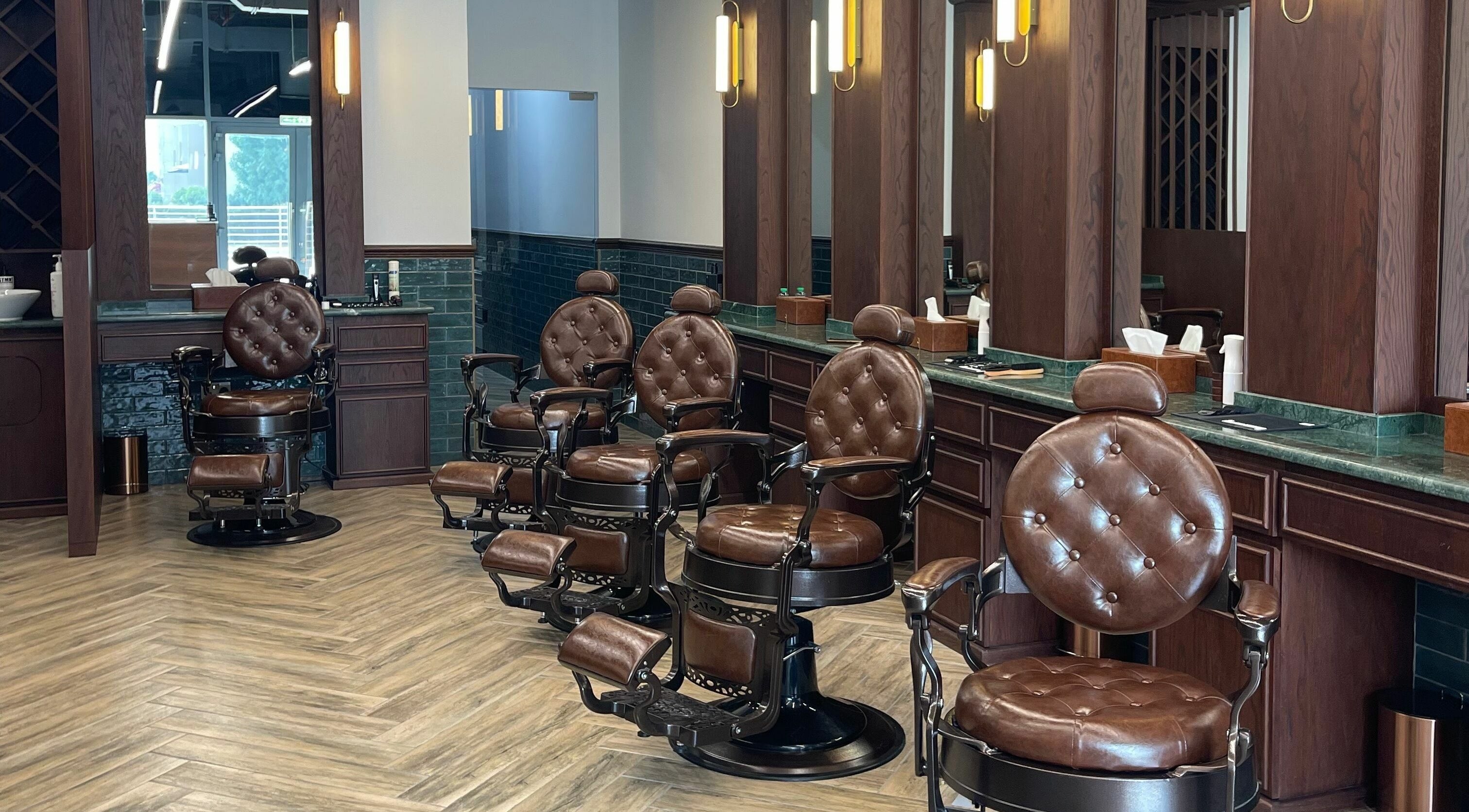 Luxurious barber chairs at The Barber Hub Gents on LLC, Dubai, Dubai, AE offering premium grooming services.