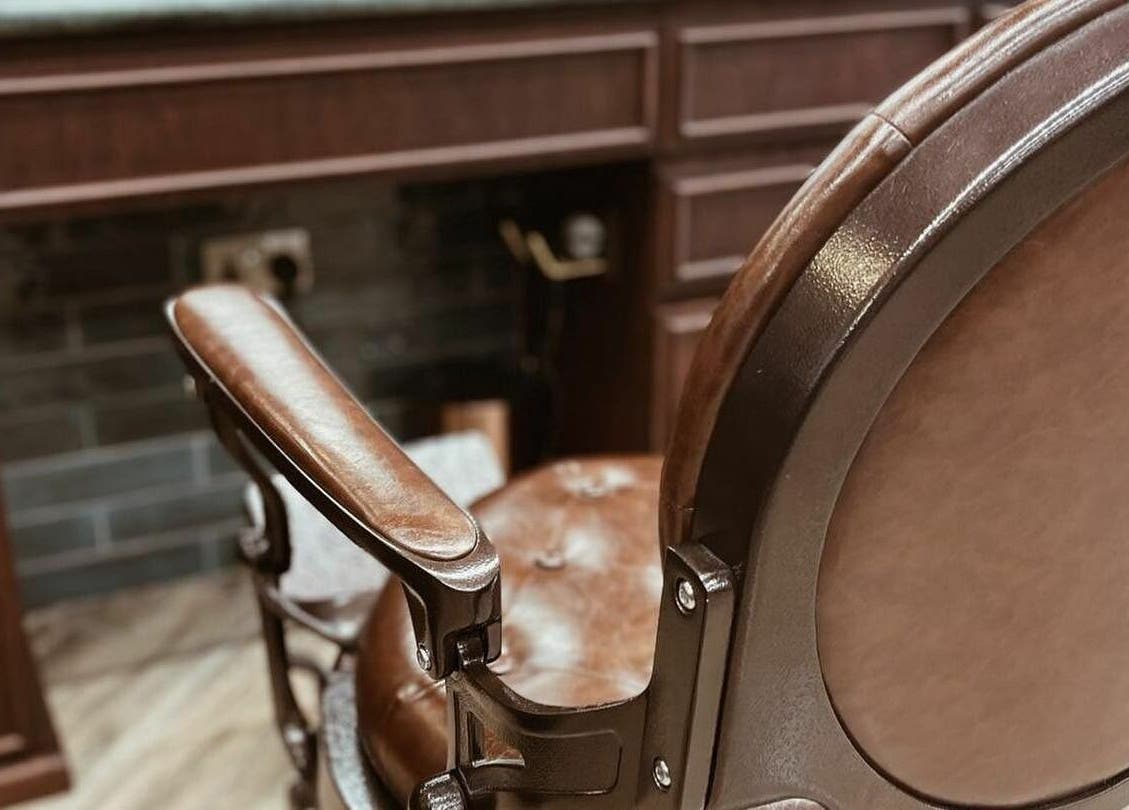 Luxurious vintage barber chair at The Barber Hub Gents on LLC in Dubai, Dubai, AE, showcasing elegance.