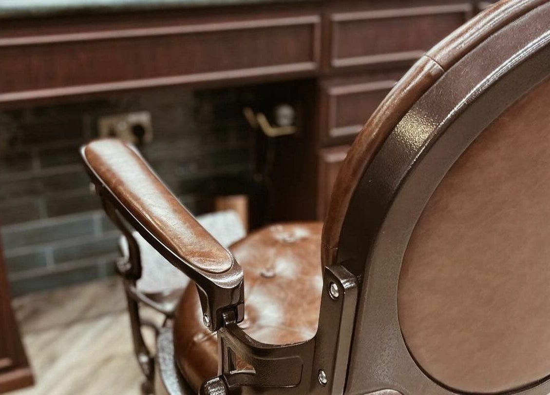 Luxurious vintage barber chair at The Barber Hub Gents on LLC in Dubai, Dubai, AE, showcasing elegance.
