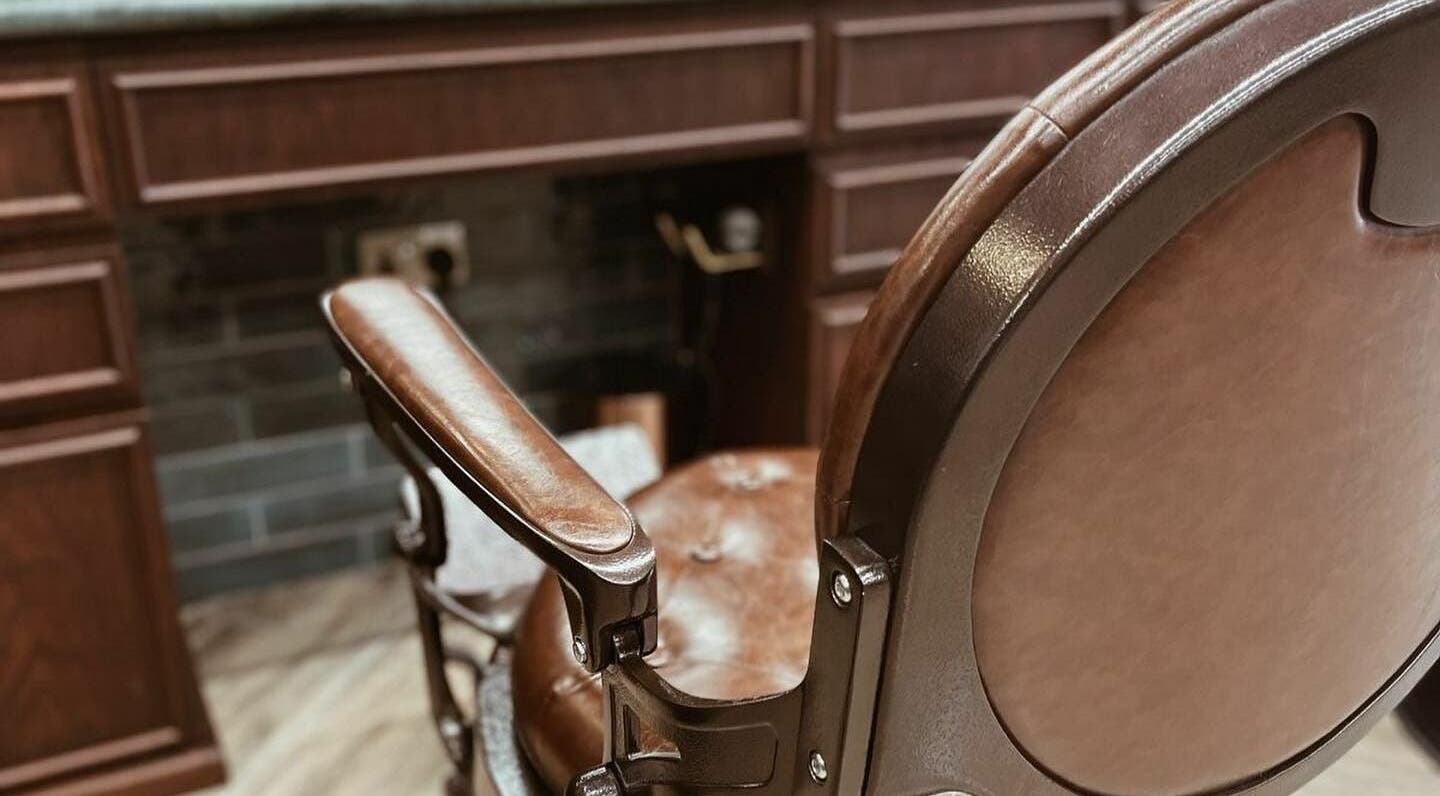 Luxurious vintage barber chair at The Barber Hub Gents on LLC in Dubai, Dubai, AE, showcasing elegance.