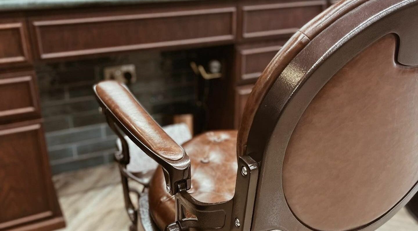 Luxurious vintage barber chair at The Barber Hub Gents on LLC in Dubai, Dubai, AE, showcasing elegance.