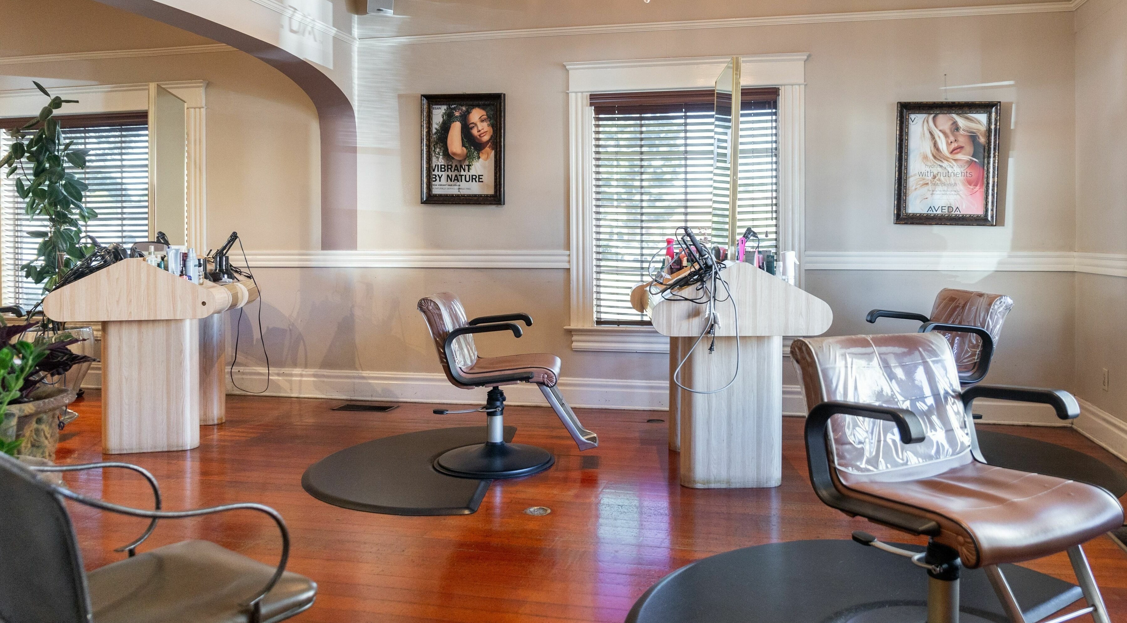 Modern salon interior at Salon Benardo, Fullerton, California, US, featuring stylish chairs and wooden décor.