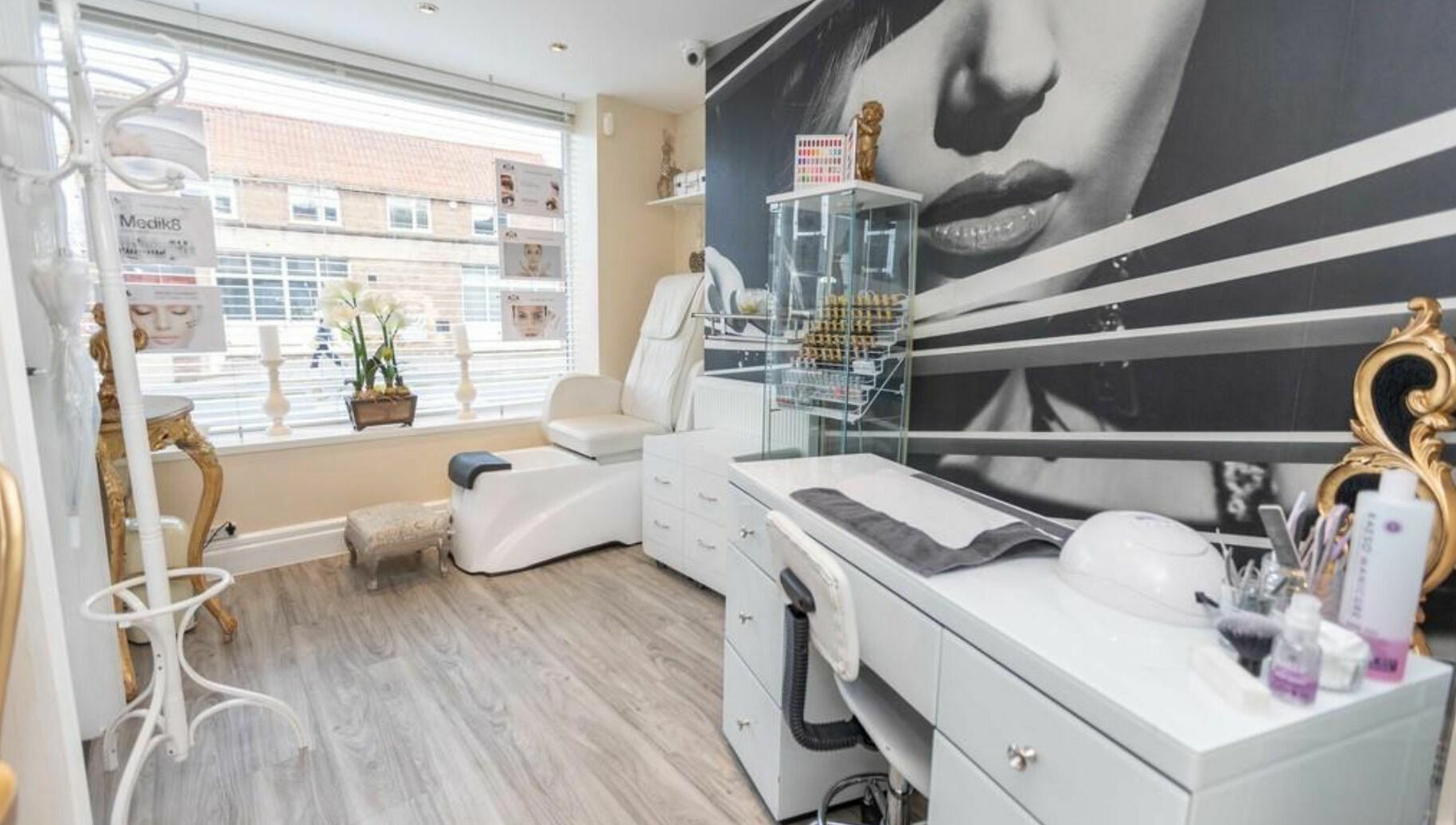 Luxurious beauty room at High Grade House in Acle, England, GB, featuring plush seating and stylish decor.