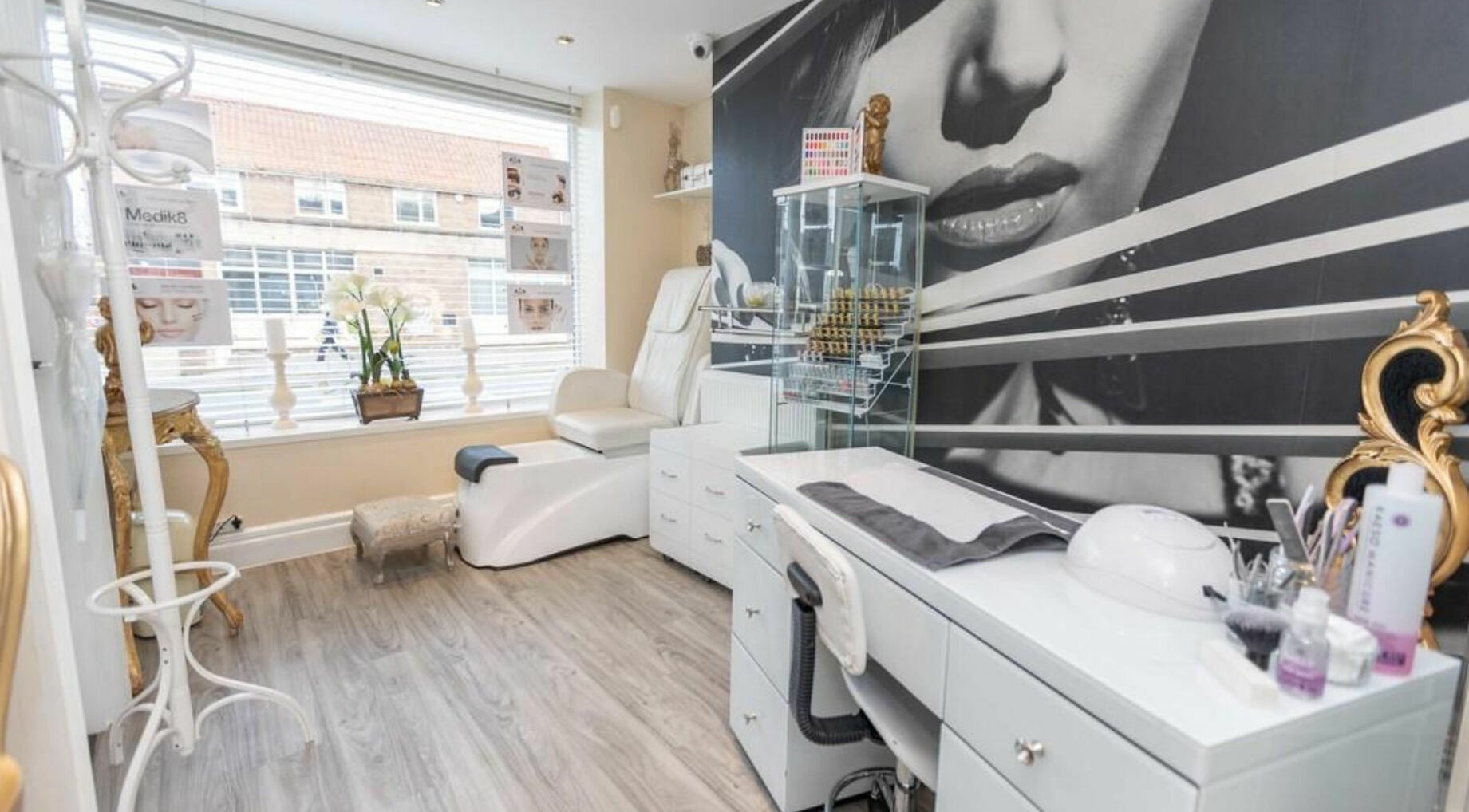 Luxurious beauty room at High Grade House in Acle, England, GB, featuring plush seating and stylish decor.