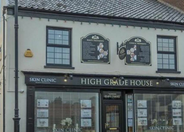 Front view of High Grade House skin clinic located in Acle, England, GB, showcasing inviting exterior design.