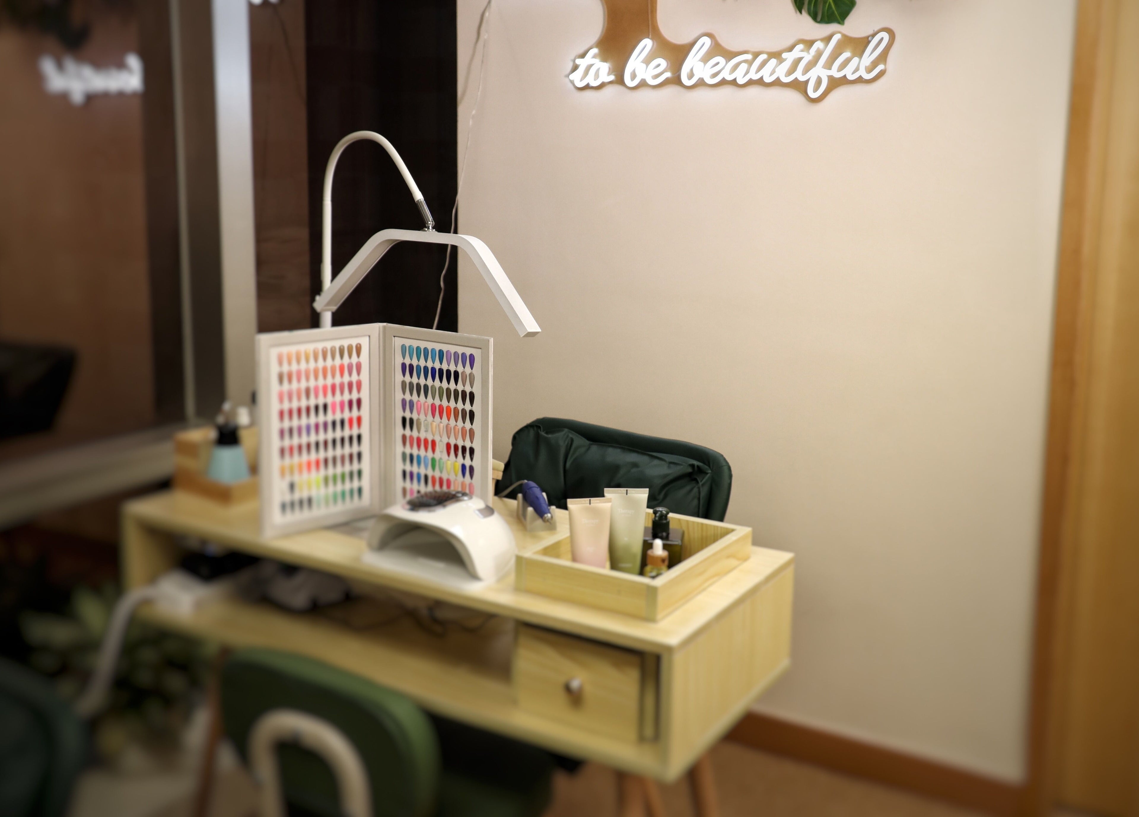 Cozy nail station at The Bar, Hong Kong Island, featuring polishes and decor for a soothing beauty experience.